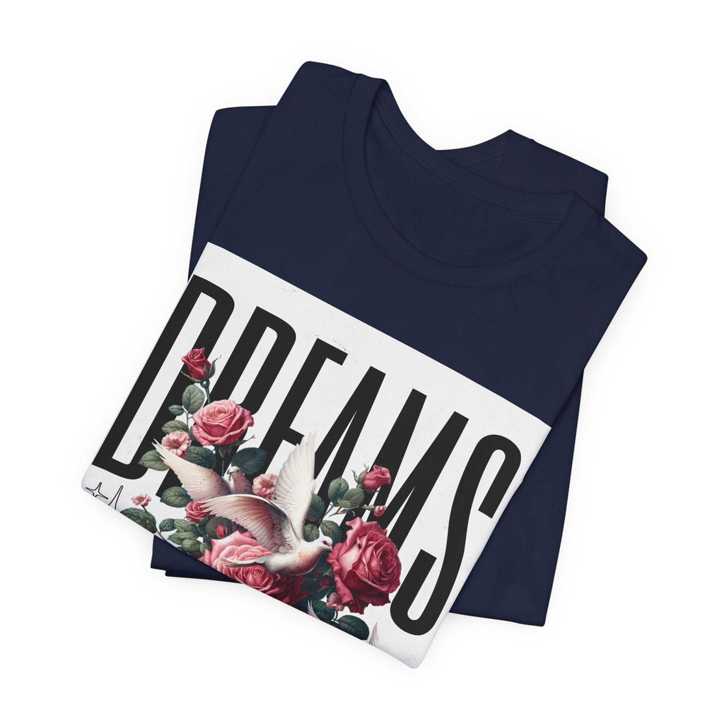 Navy Dreams Floral Tee with bold typography, pink roses, and white dove graphic, folded display