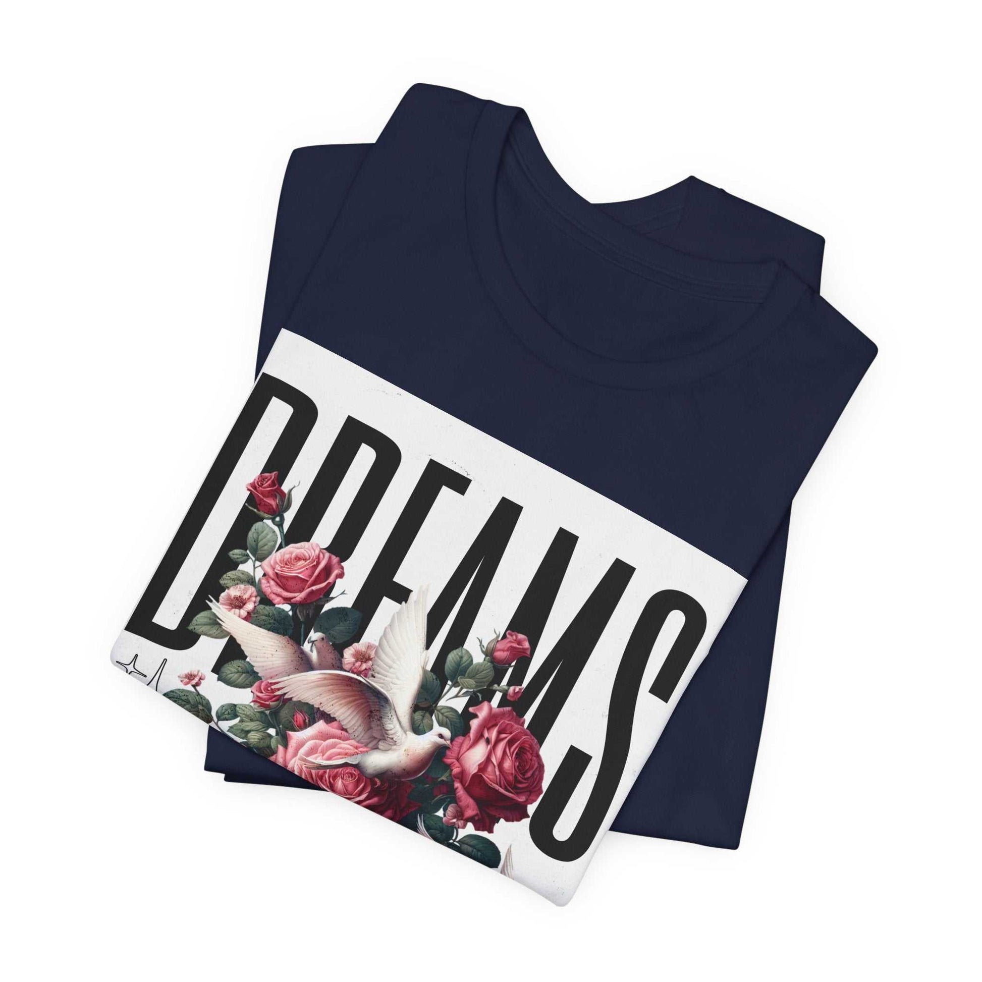 Navy Dreams Floral Tee with bold typography, pink roses, and white dove graphic, folded display