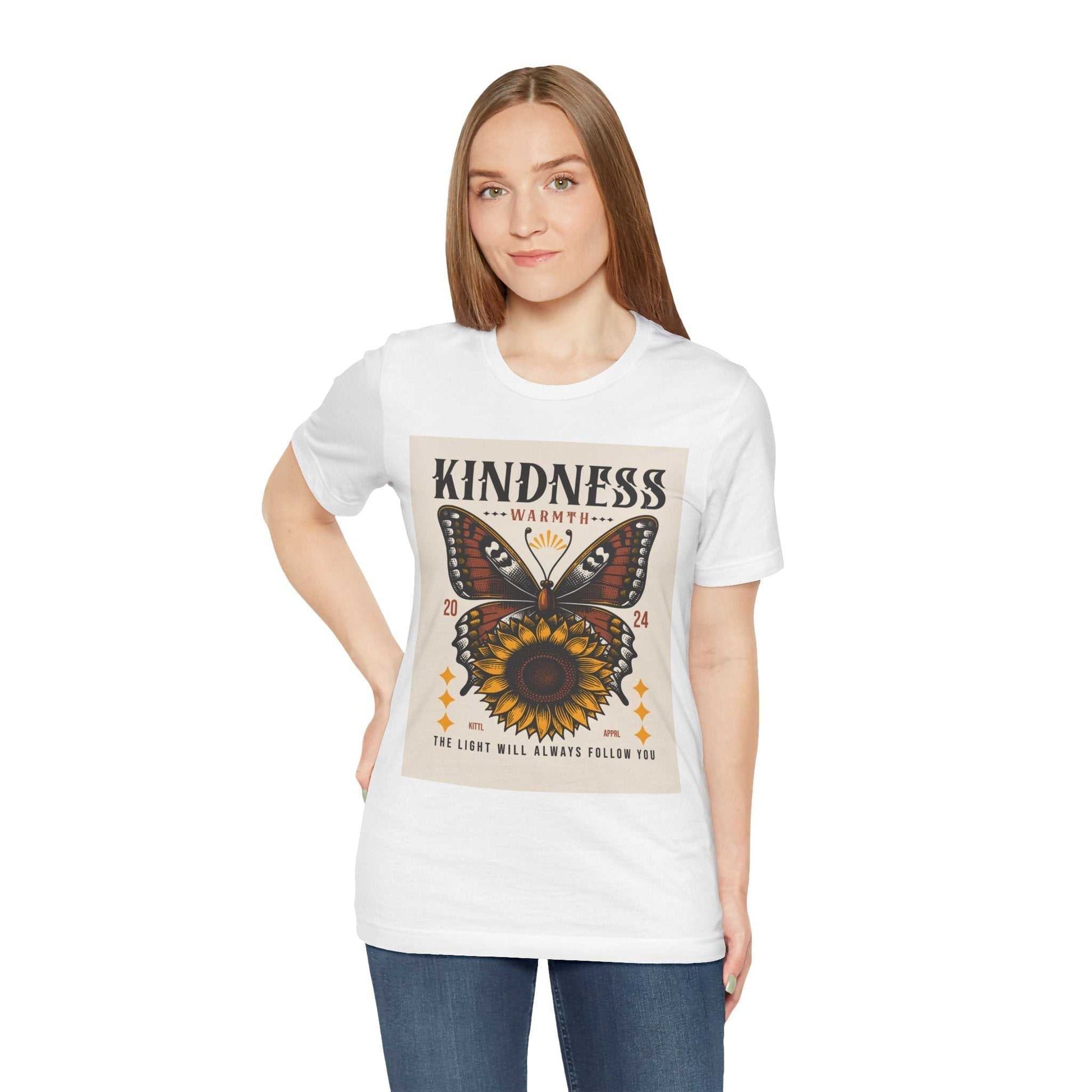 Woman wearing white Kindness Butterfly Tee with butterfly and sunflower graphic and positive message