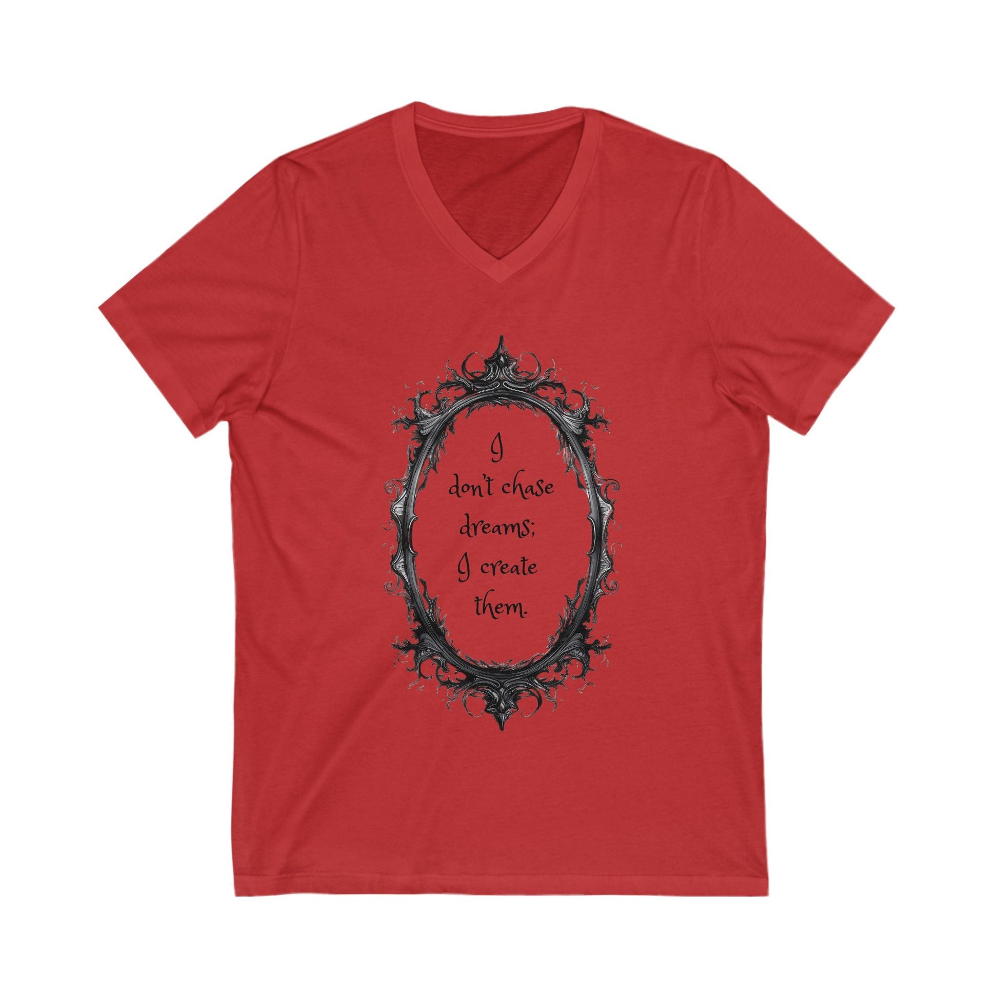 Red unisex V-neck tee with decorative black frame and motivational quote "I don't chase dreams; I create them" on front, made of soft cotton.