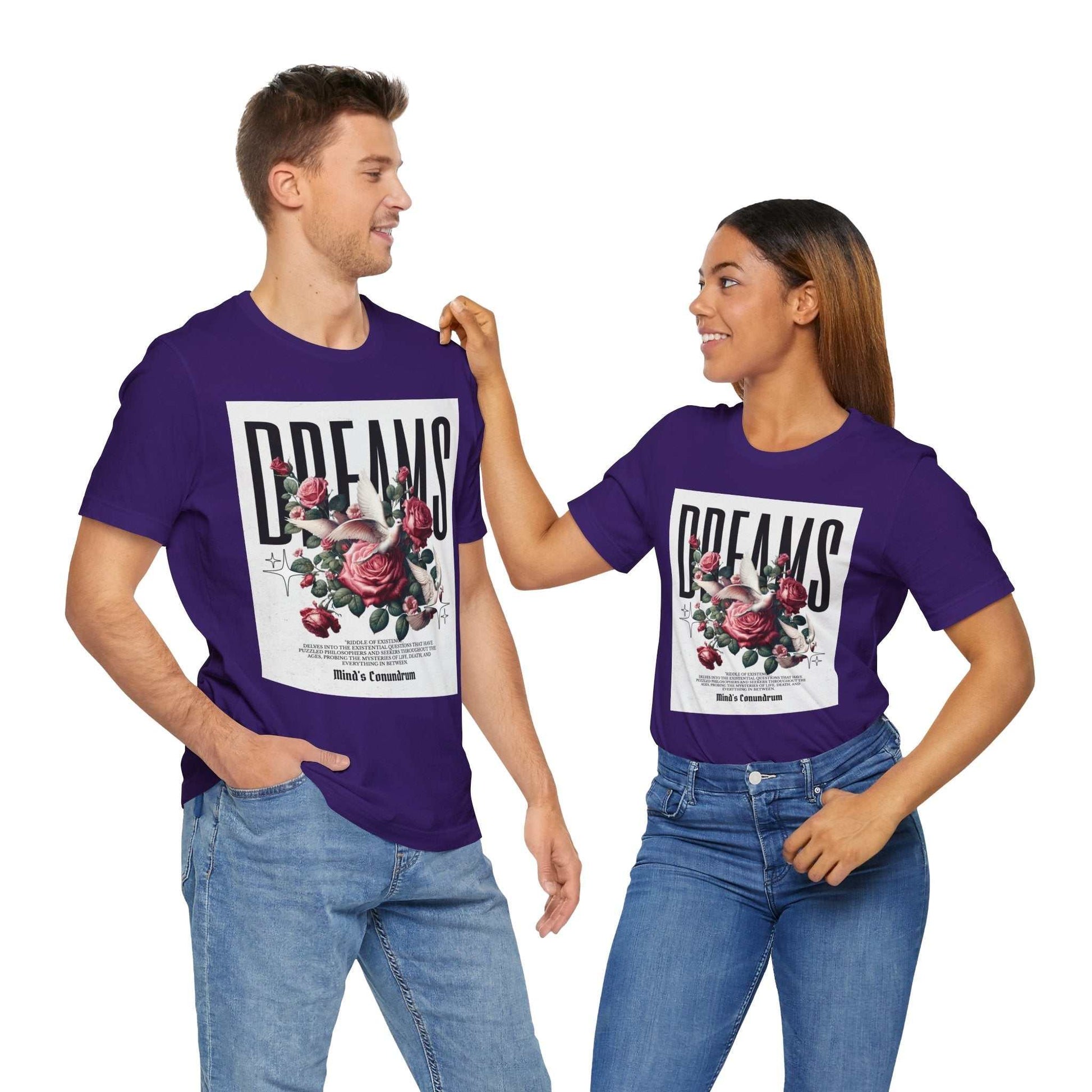 Couple wearing purple Dreams Floral Tee with bold floral graphic and typography, styled casually with jeans.