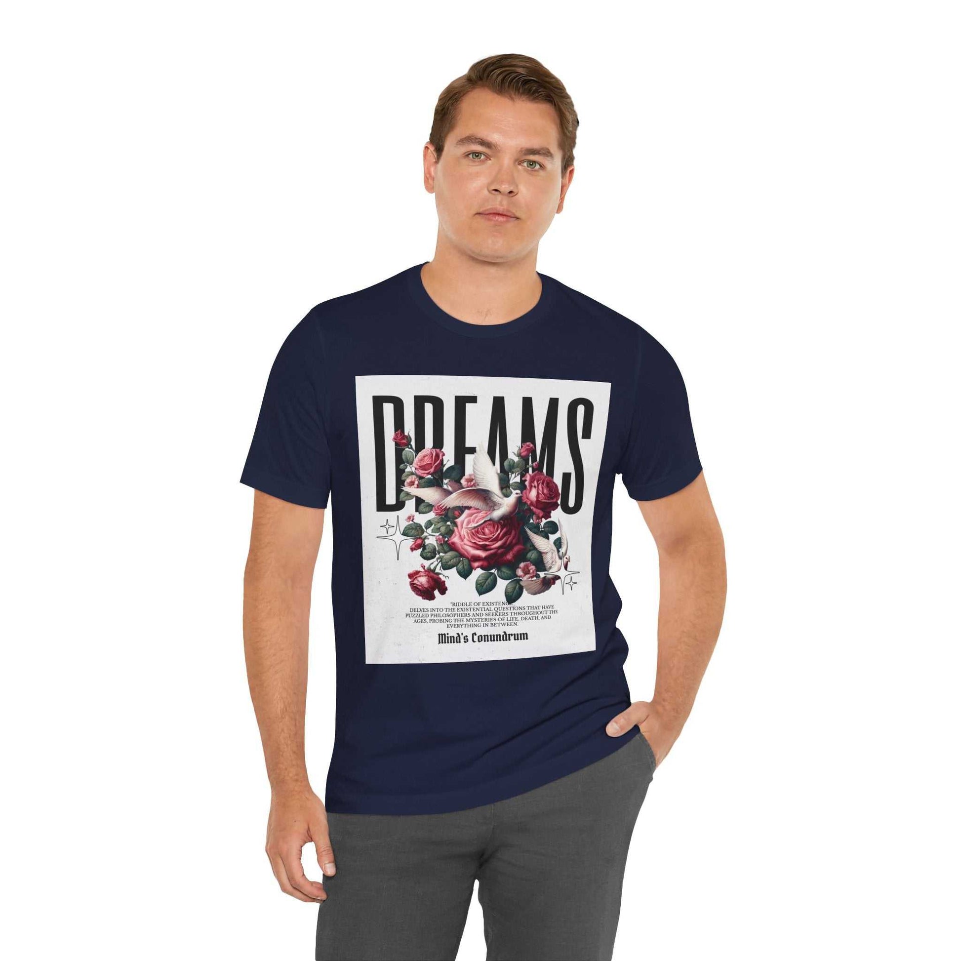 Man wearing navy blue Dreams Floral Tee with rose graphic and bold text on front