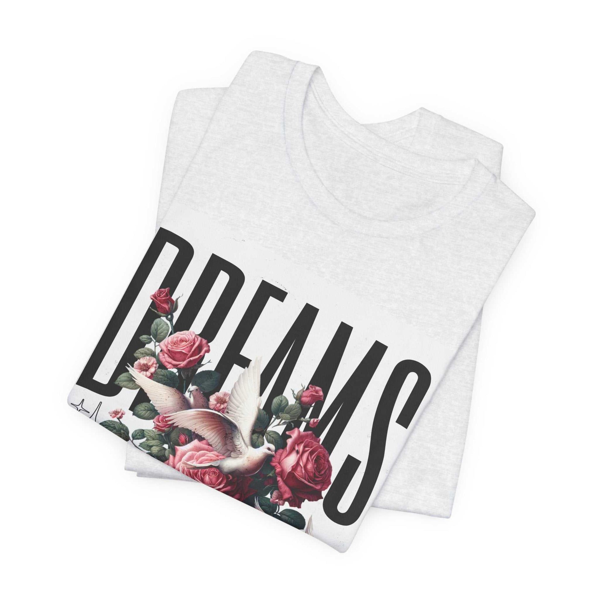 White Dreams Floral Tee with pink roses and a bird graphic folded flat