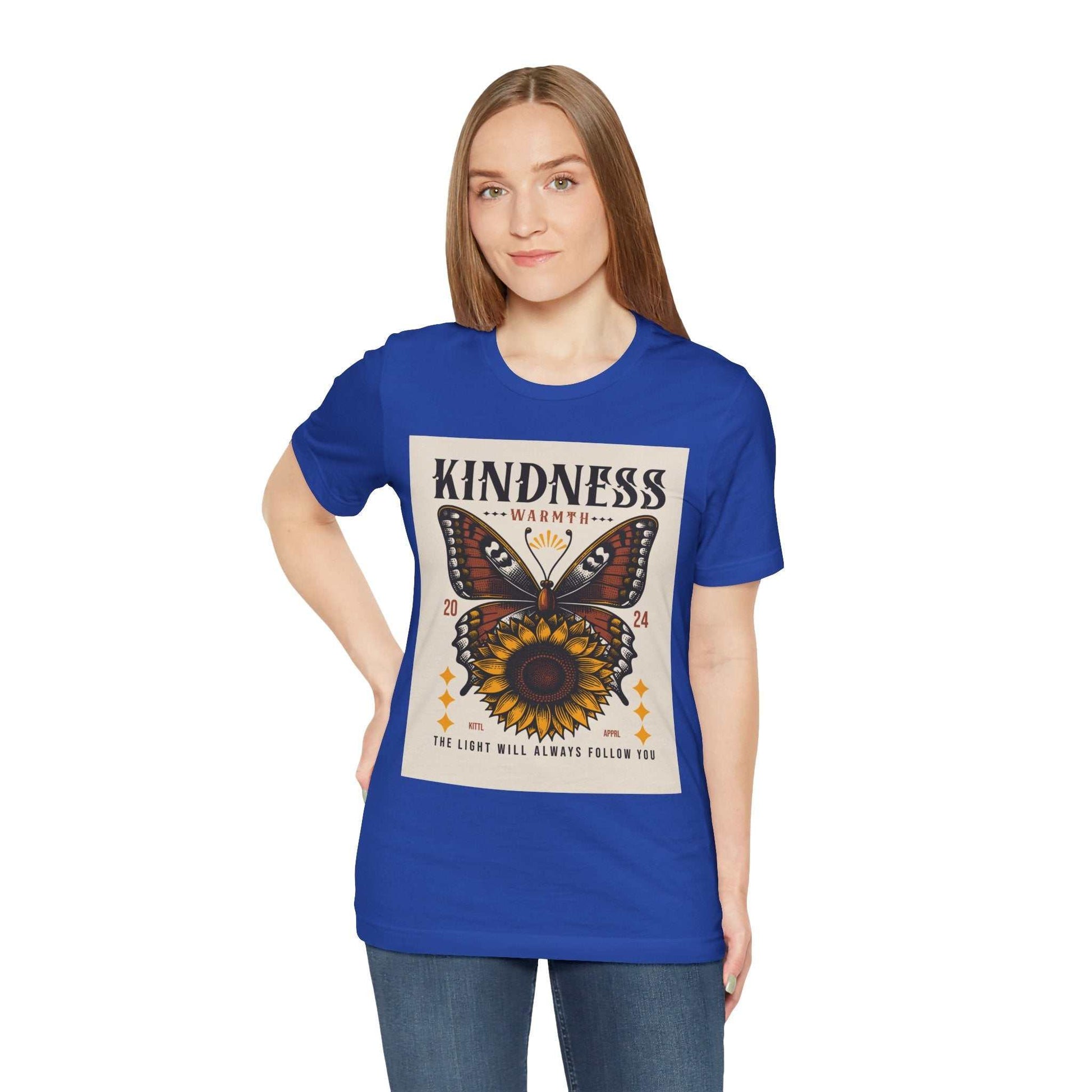 Woman wearing royal blue Kindness Butterfly Tee with butterfly and sunflower design and positive message