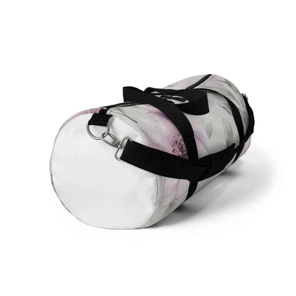 Small floral pattern duffel bag with black adjustable strap and zipper closure, made of durable polyester