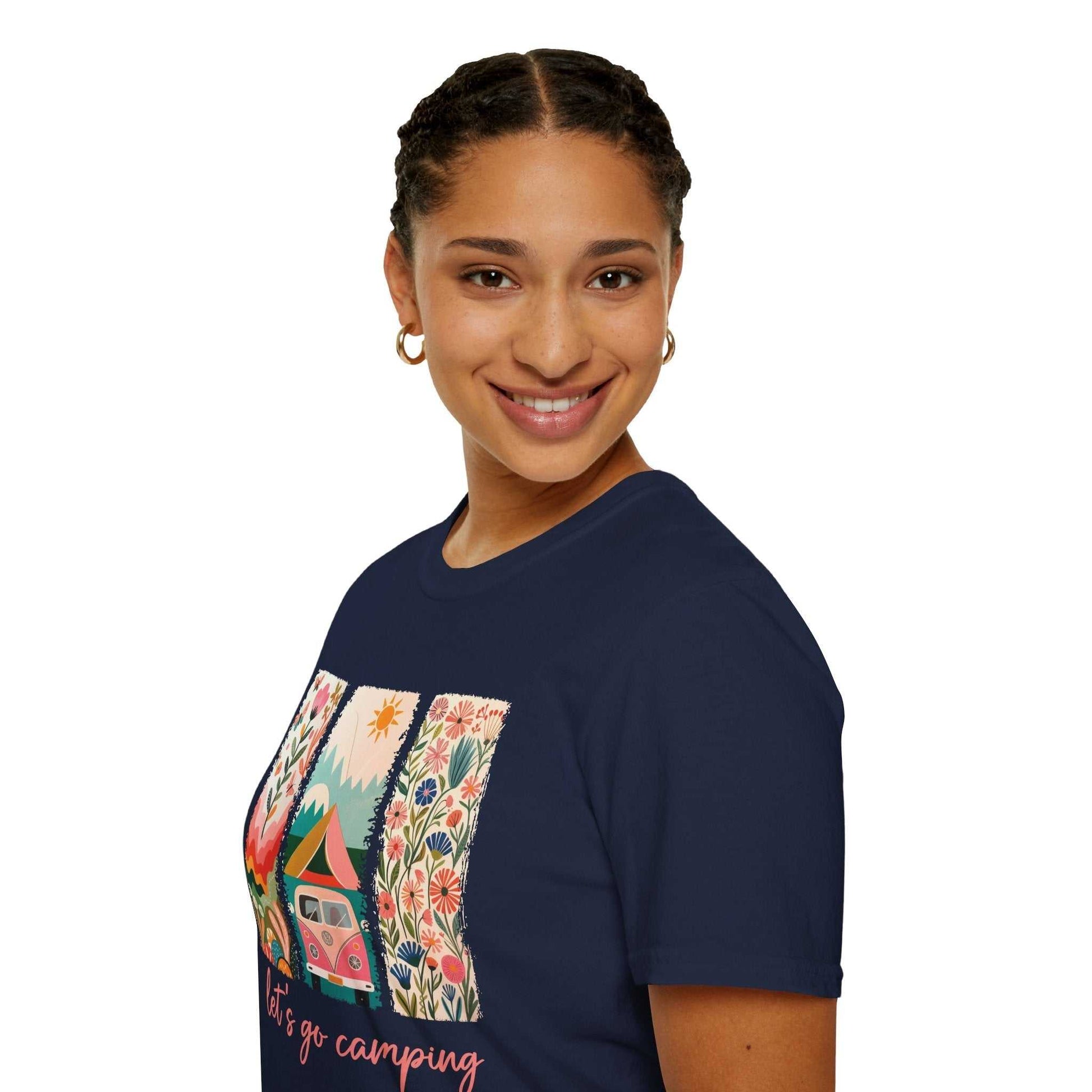 Woman wearing navy unisex softstyle t-shirt with colorful camping adventure design