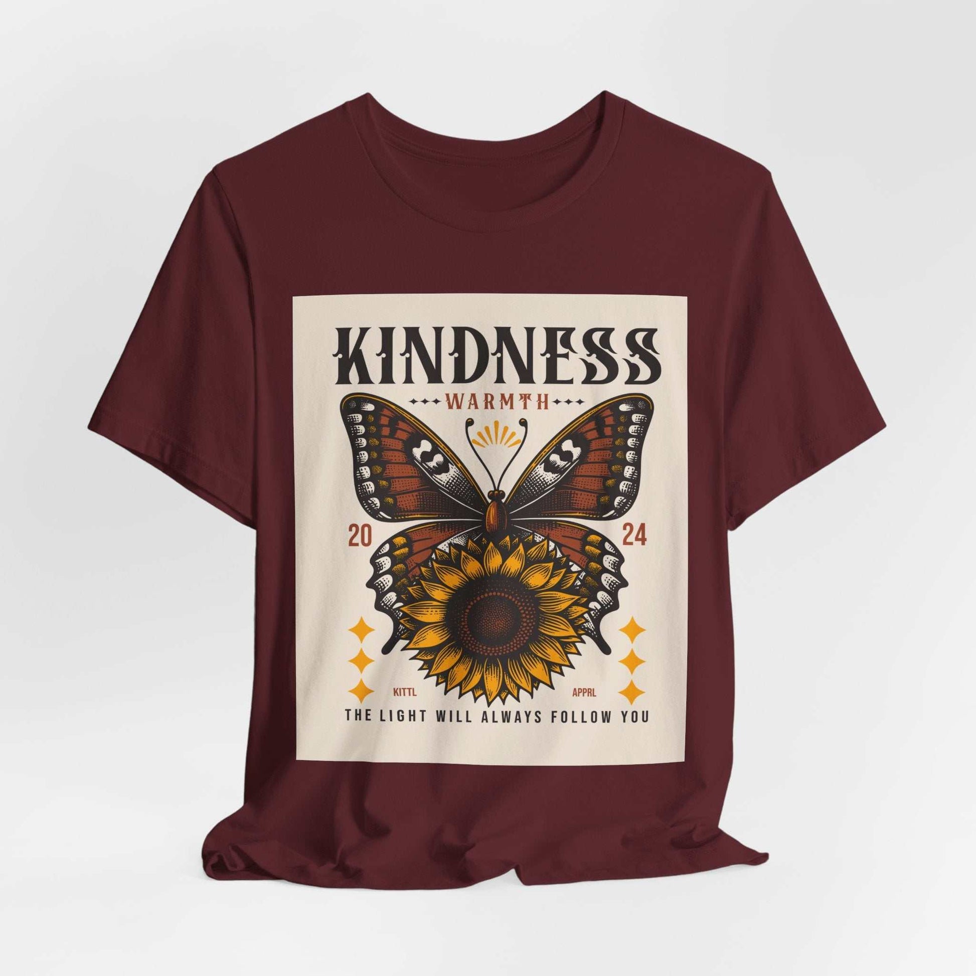 Maroon Kindness Butterfly Tee featuring a butterfly and sunflower graphic with inspirational text on front