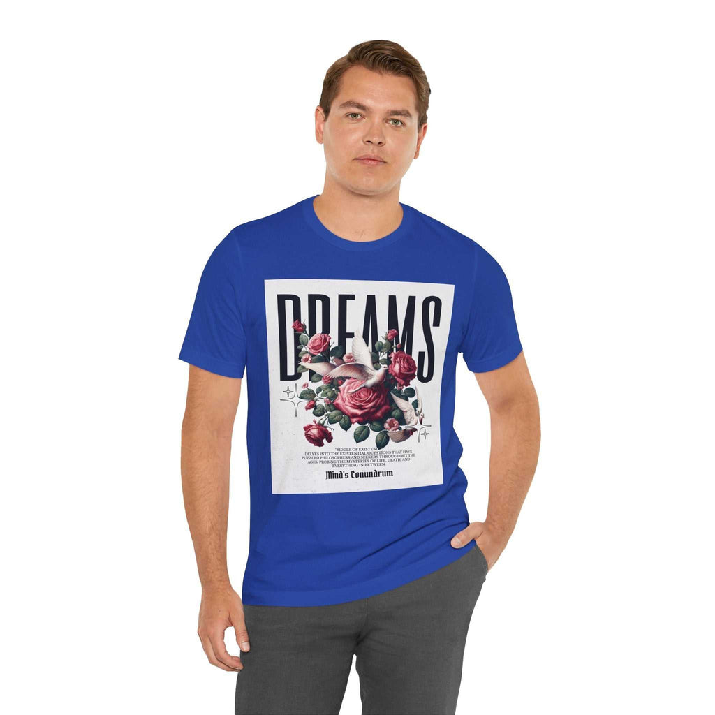 Man wearing a blue Dreams Floral Tee with rose graphic and bold typography on front