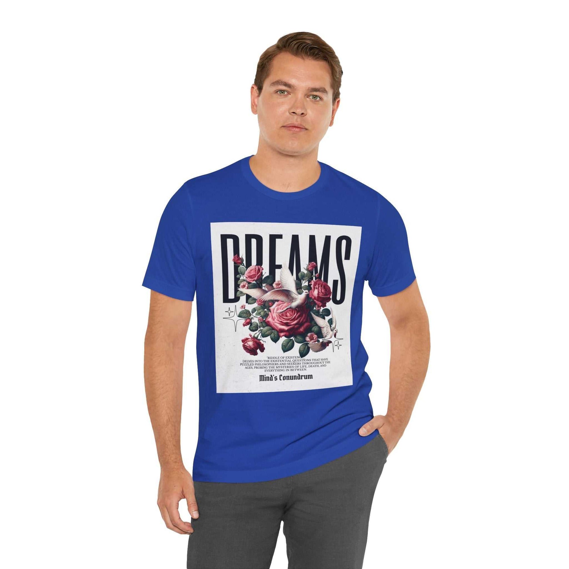 Man wearing a blue Dreams Floral Tee with rose graphic and bold typography on front