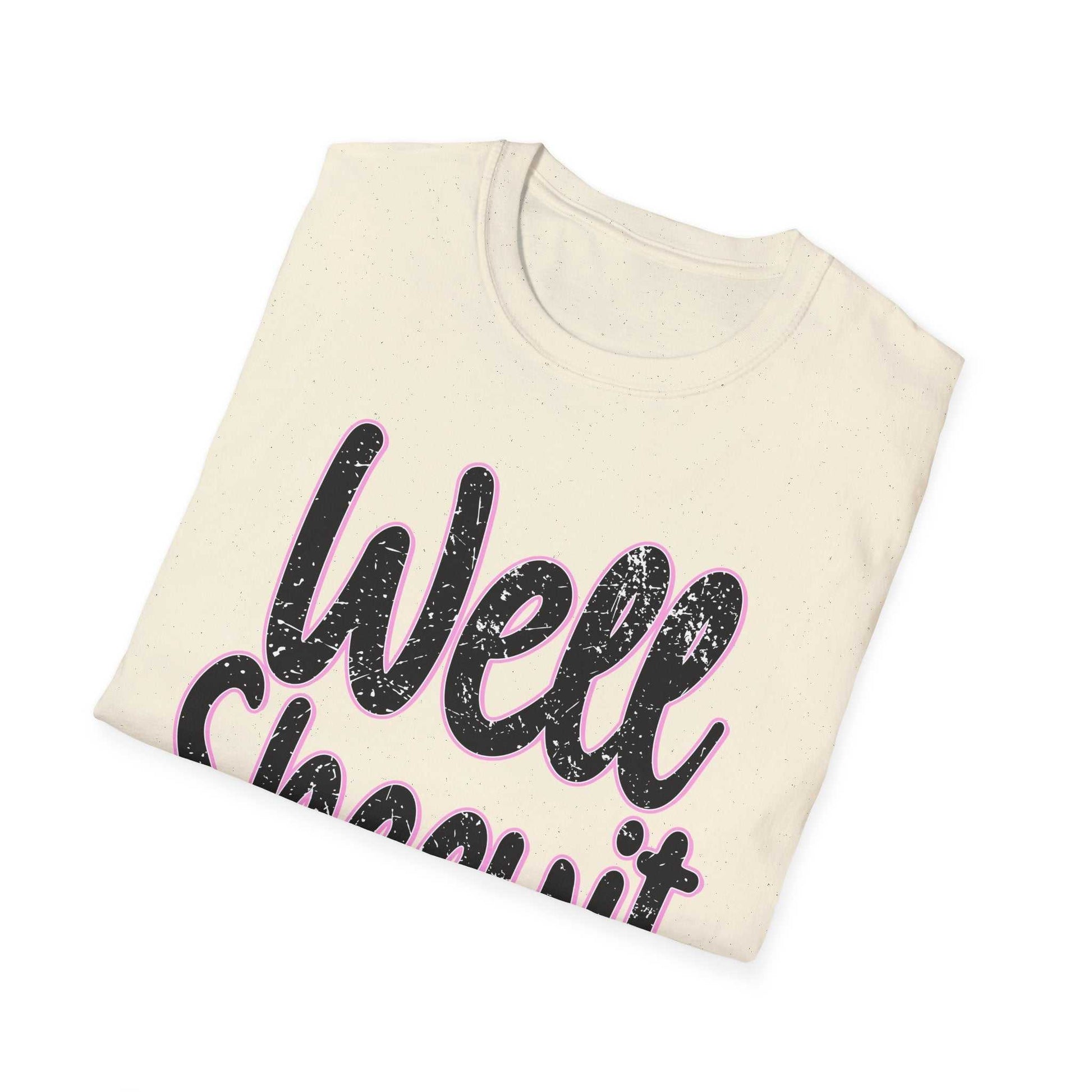 Folded casual statement tee with funny "Well Sheeyit" quote printed on front in black and pink text