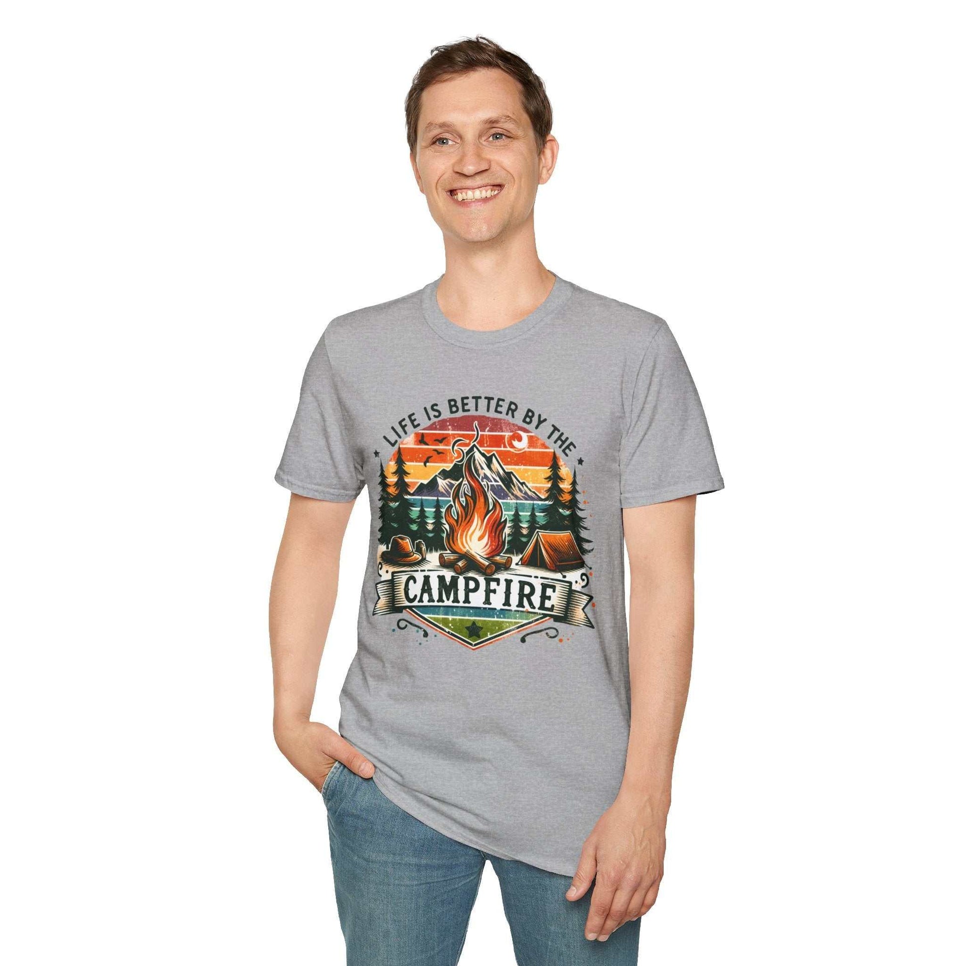 Man wearing grey Camping Adventure Unisex T-Shirt with campfire graphic and "Life is better by the campfire" text
