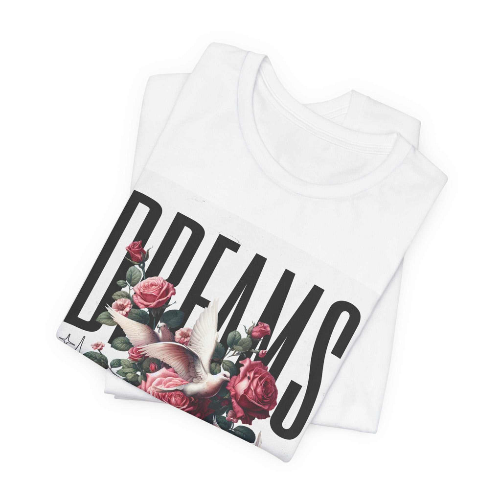 White Dreams Floral Tee with large black "DREAMS" text, pink roses, and a white dove graphic.