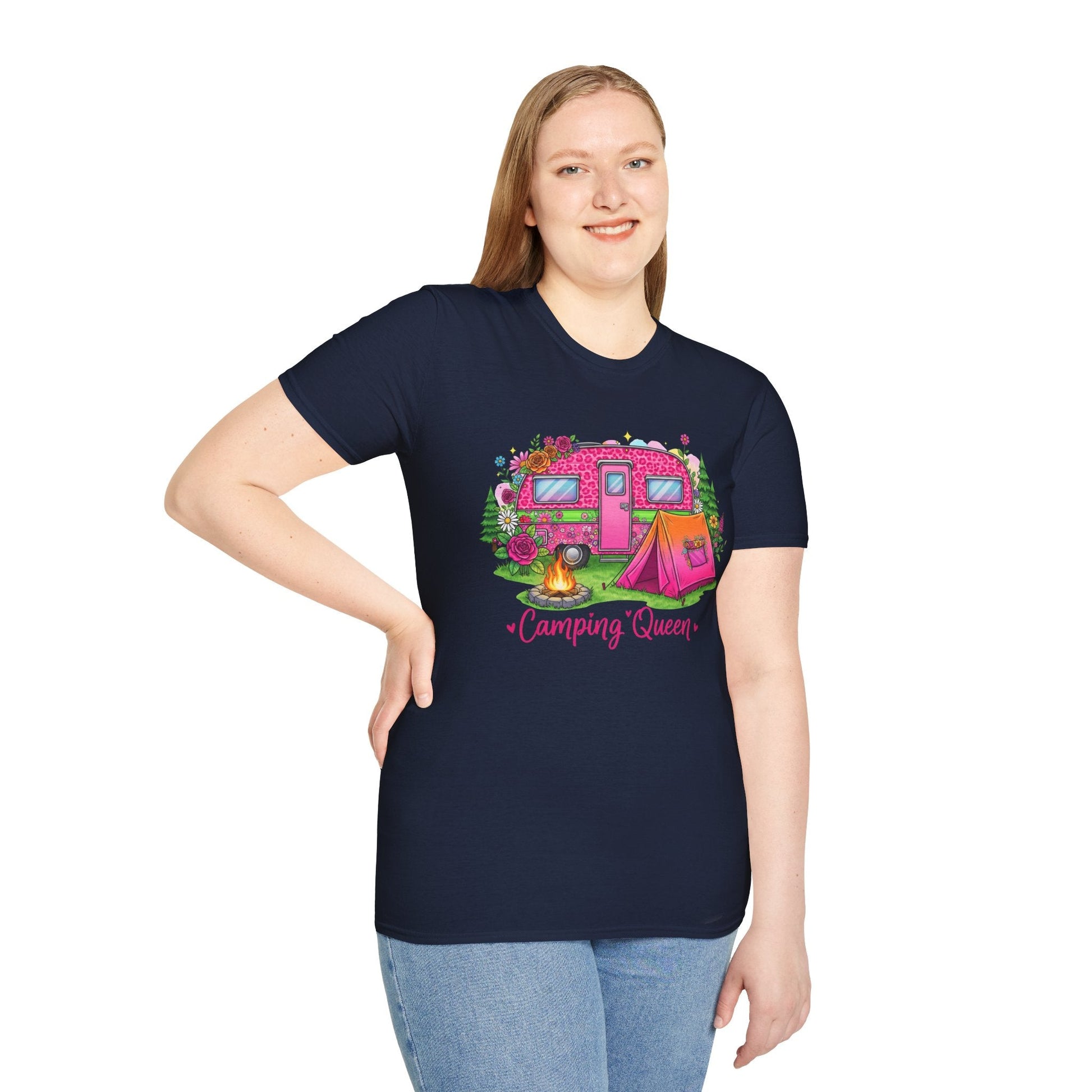 Woman wearing navy Camping Queen T-Shirt with pink camper, tent, campfire, and floral design