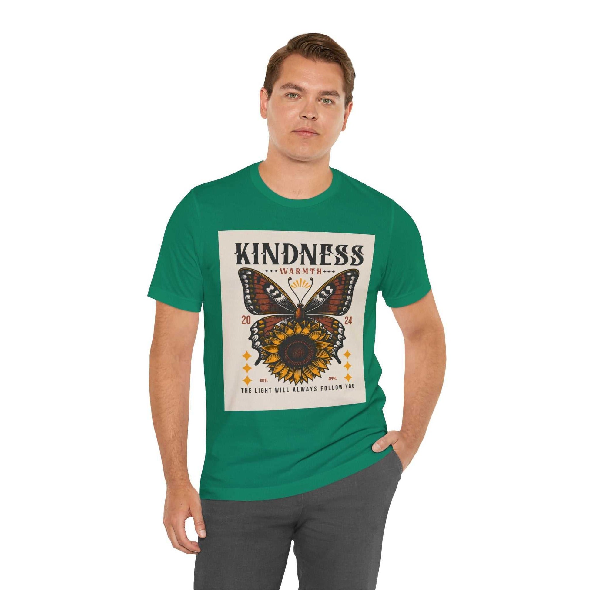 Man wearing green Kindness Butterfly Tee with butterfly and sunflower design and kindness message