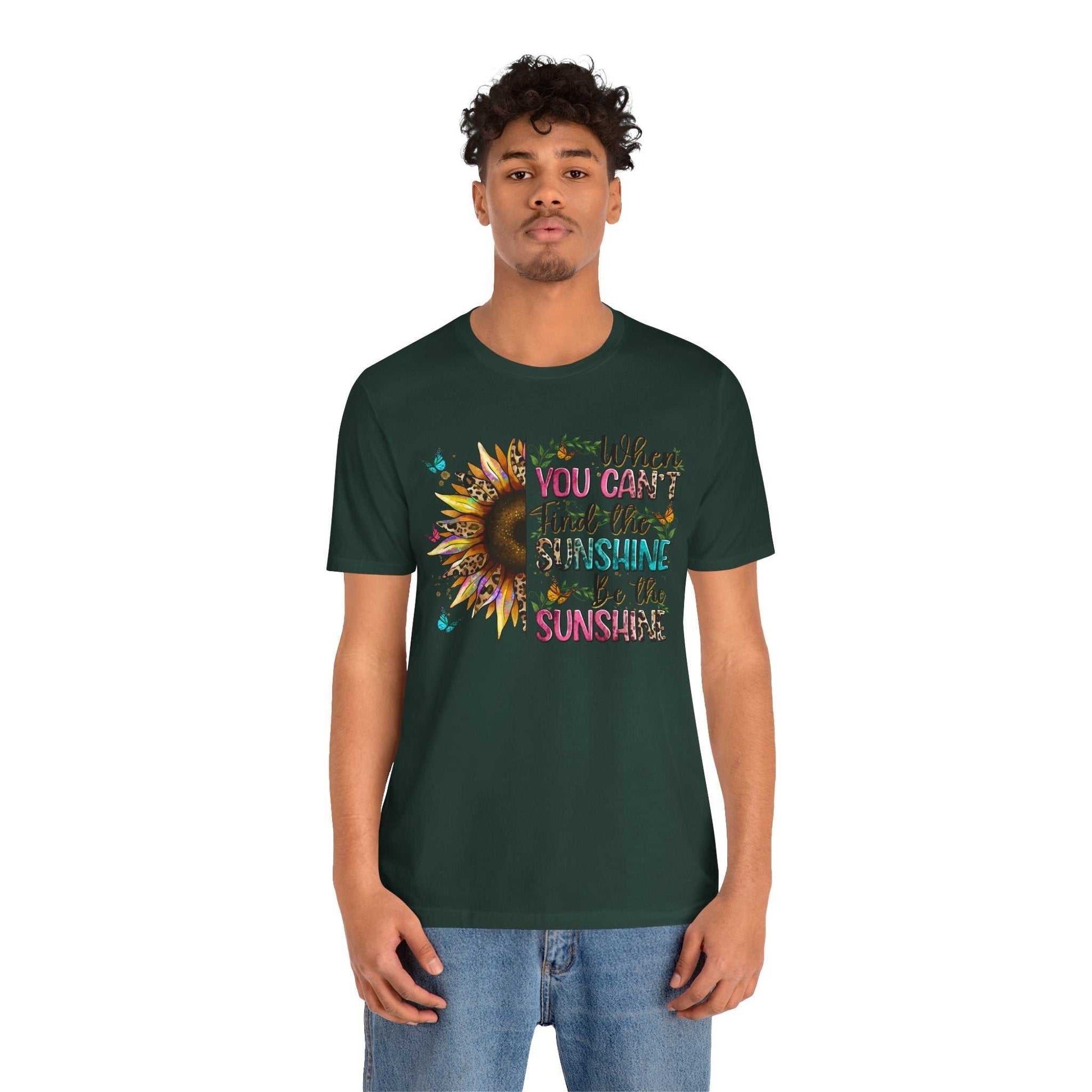 Unisex dark green Sunshine Quote Tee featuring colorful sunflower graphic and inspirational text, made from soft breathable cotton.