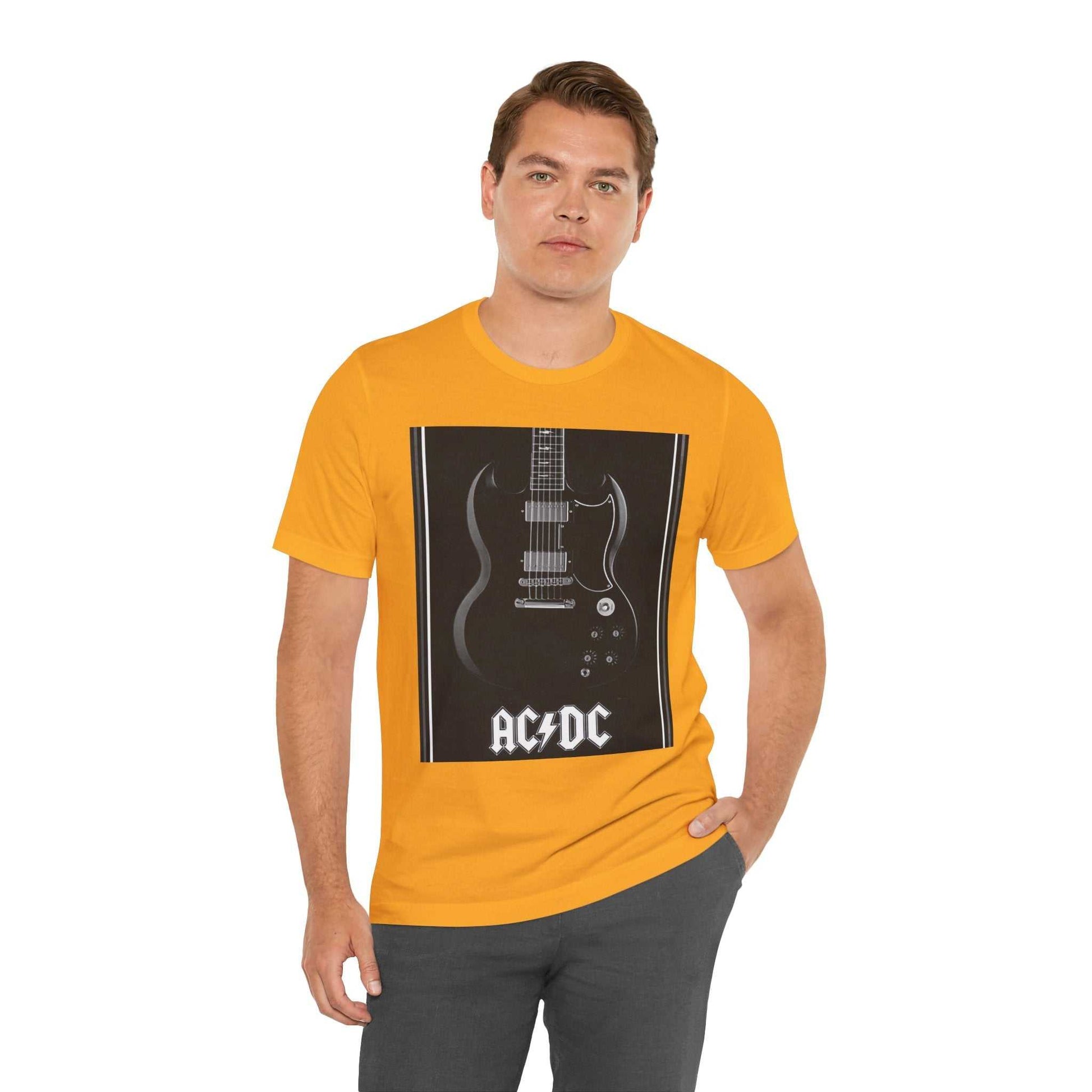 Man wearing yellow rock guitar graphic tee with AC/DC design and black pants