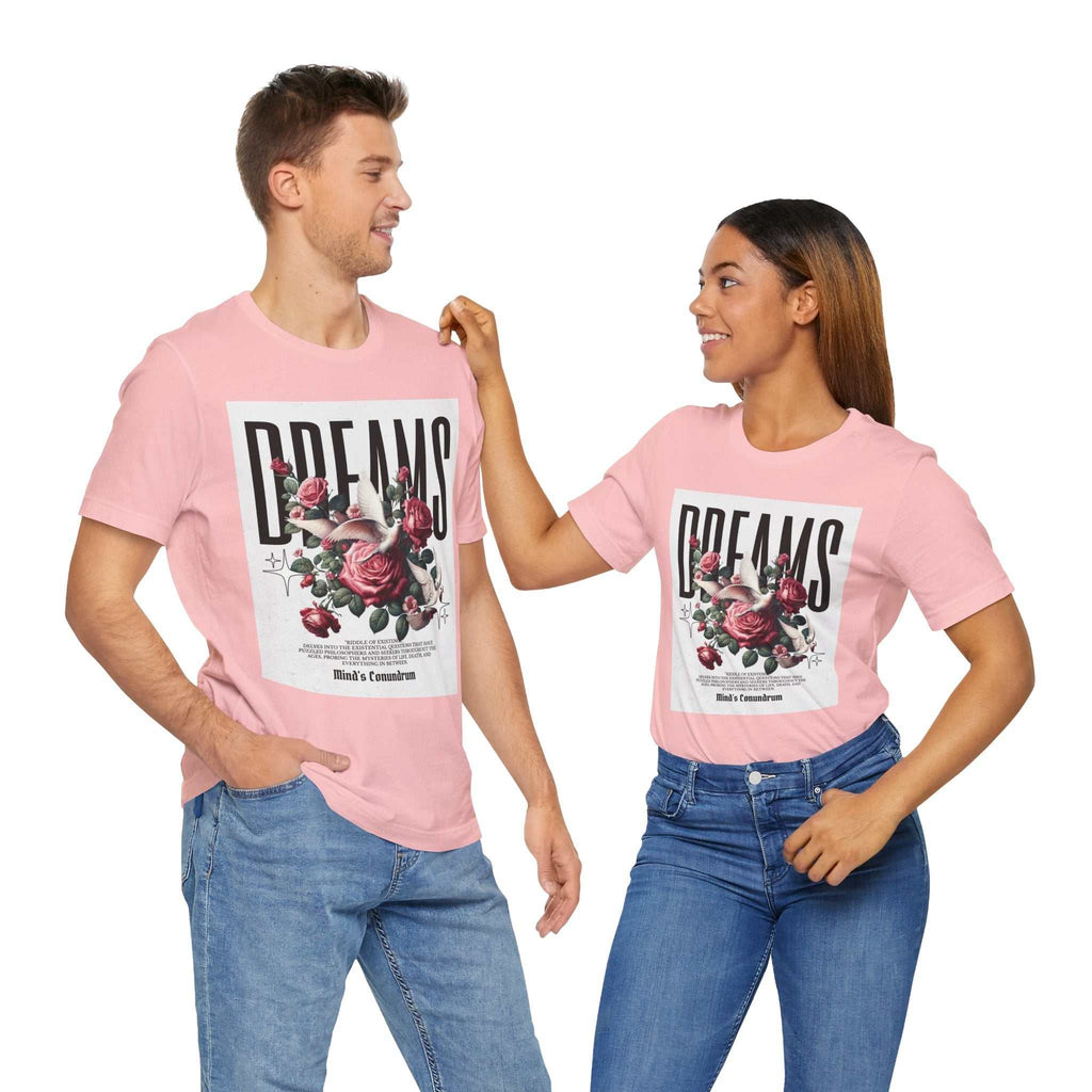Two models wearing pink Dreams Floral Tee with large floral and bold typography print on front, paired with blue jeans.