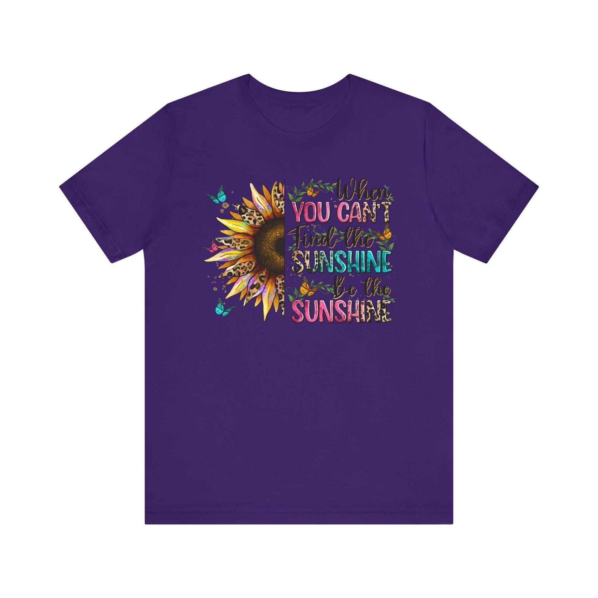 Purple unisex t-shirt with a colorful sunflower and motivational sunshine quote print on the front.