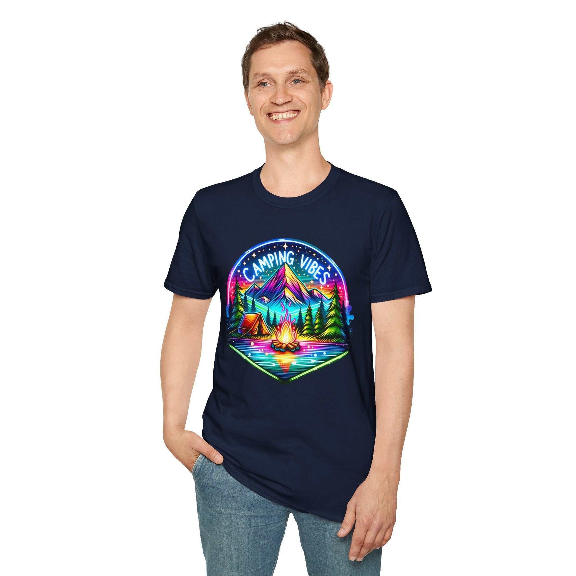 Man wearing navy blue Camping Vibes Unisex softstyle t-shirt with colorful campfire and mountain graphic
