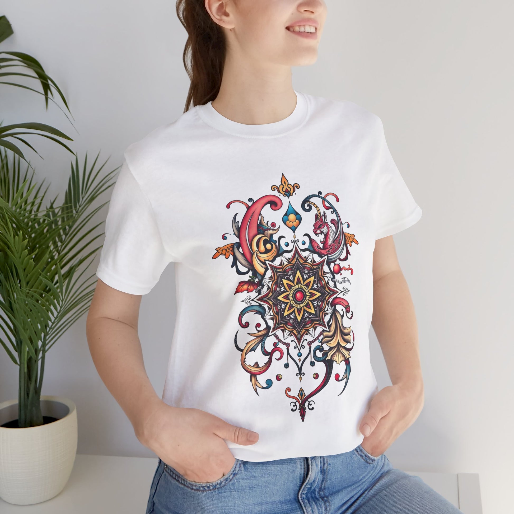 Vibrant tee with swirling mandala in reds, golds, and teal, available in many colors