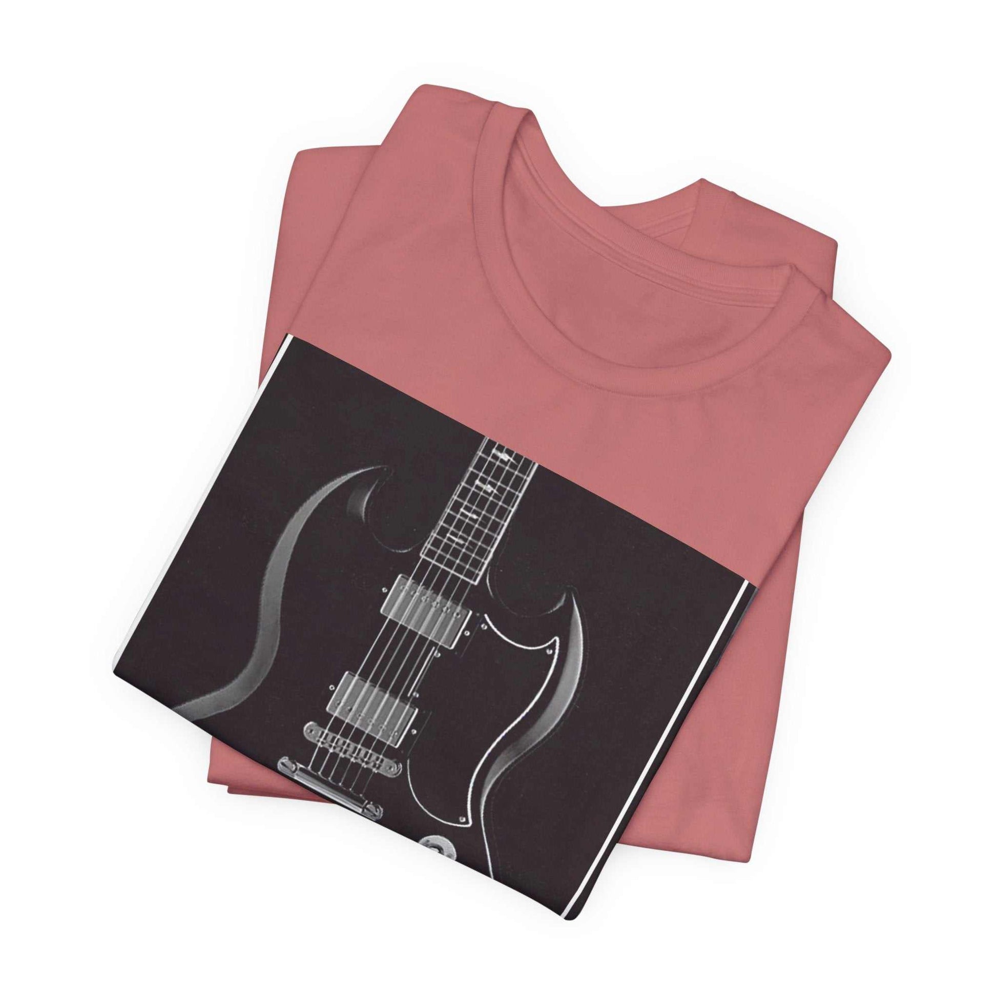 Folded dusty pink rock guitar graphic tee with black and white electric guitar print on front