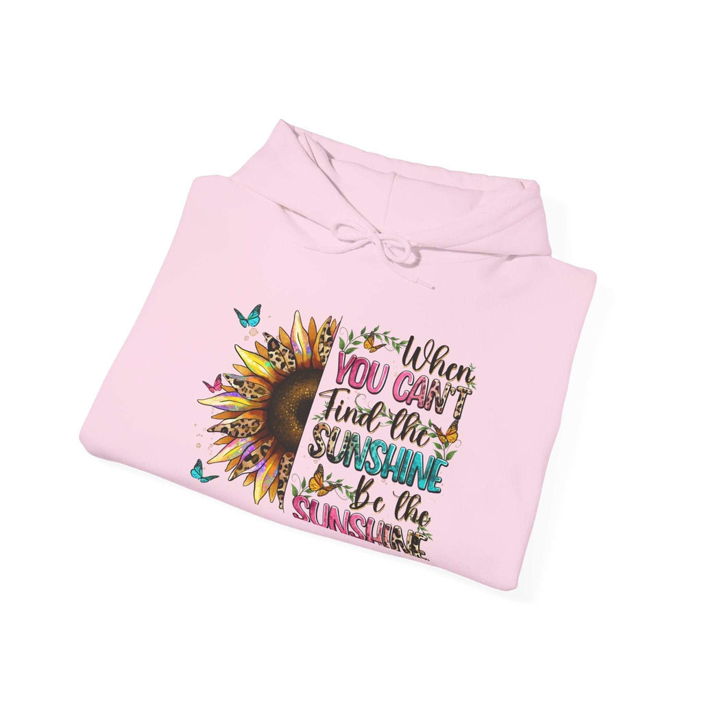 Folded pink sunflower quote hoodie with inspirational text and butterfly design