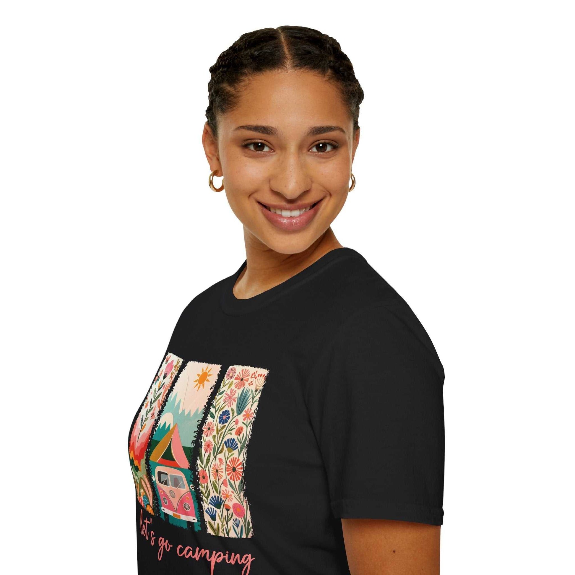 Woman wearing black unisex Camping Adventure softstyle t-shirt with colorful outdoor and camping graphic design