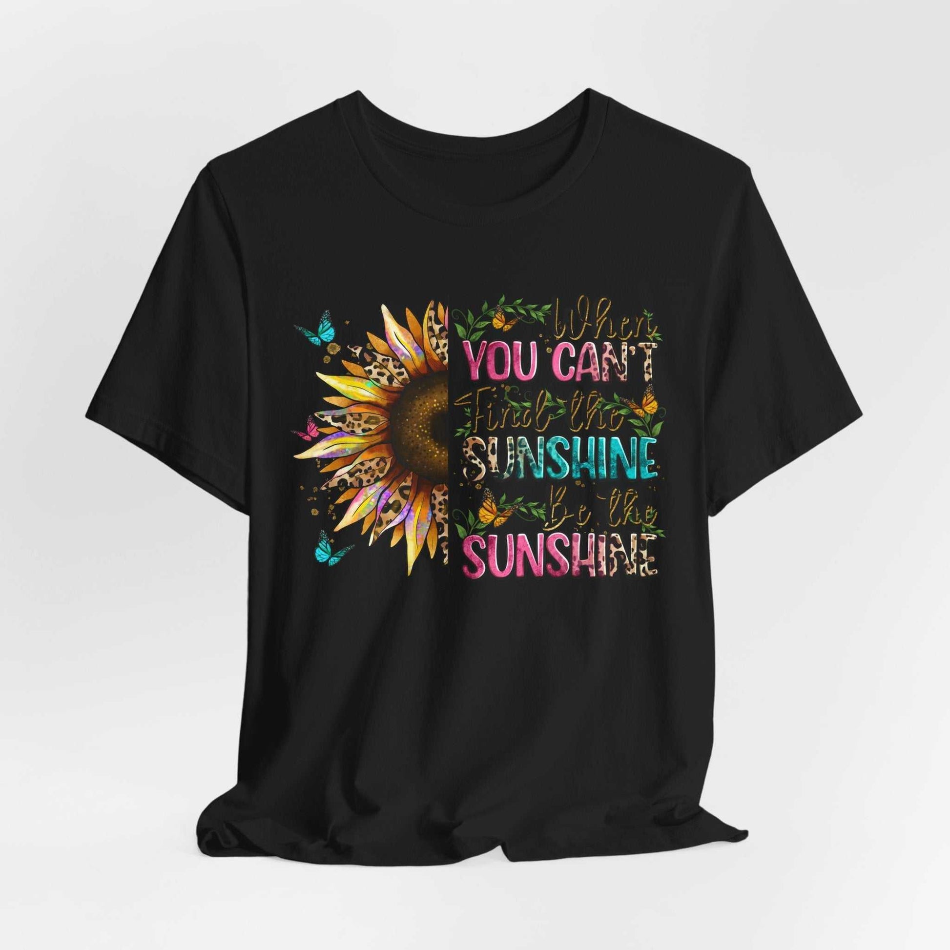 Black unisex t-shirt with colorful sunflower and motivational sunshine quote design