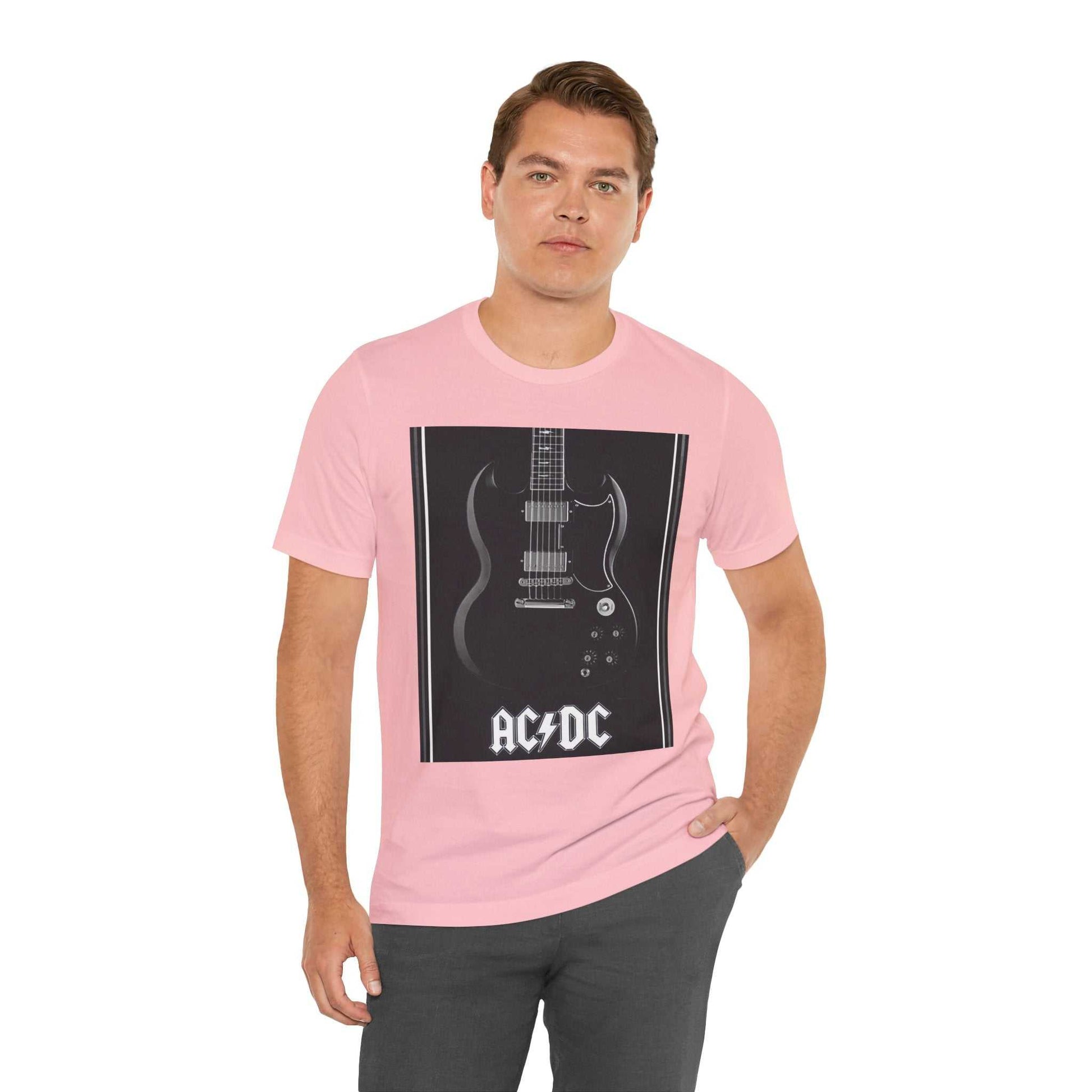 Man wearing pink rock guitar graphic tee with AC/DC guitar design and black print on front