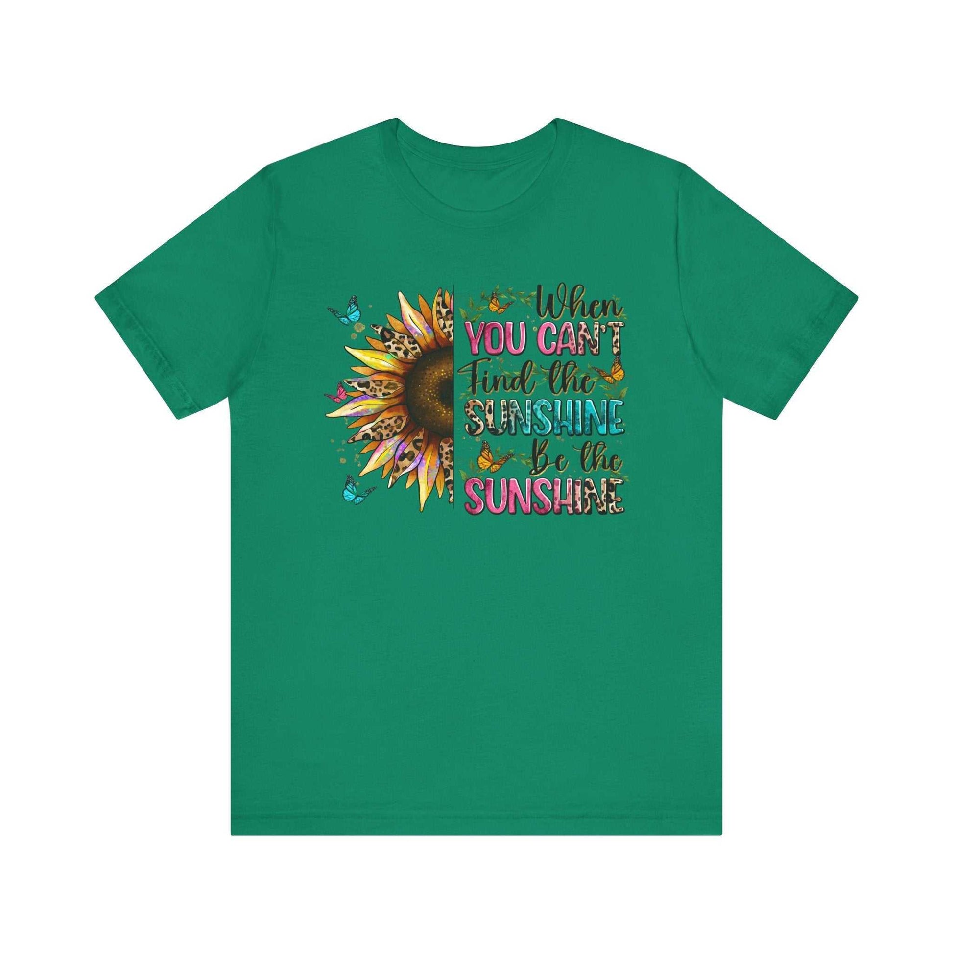 Green Sunshine Quote Tee with colorful sunflower and butterfly design and motivational text "When you can't find the sunshine, be the sunshine"