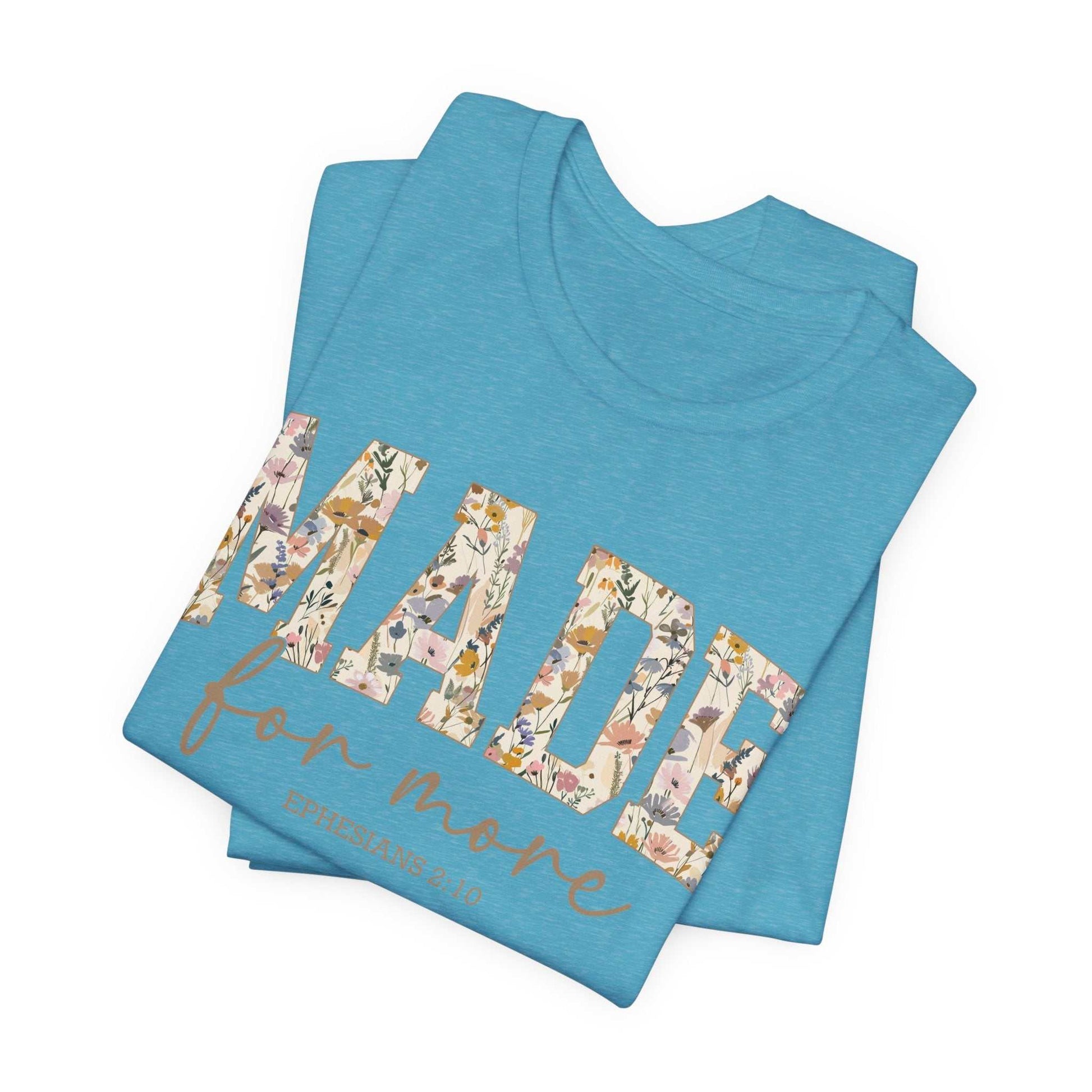 Blue folded "Made for More" floral text unisex tee shirt with Bible verse inspiration