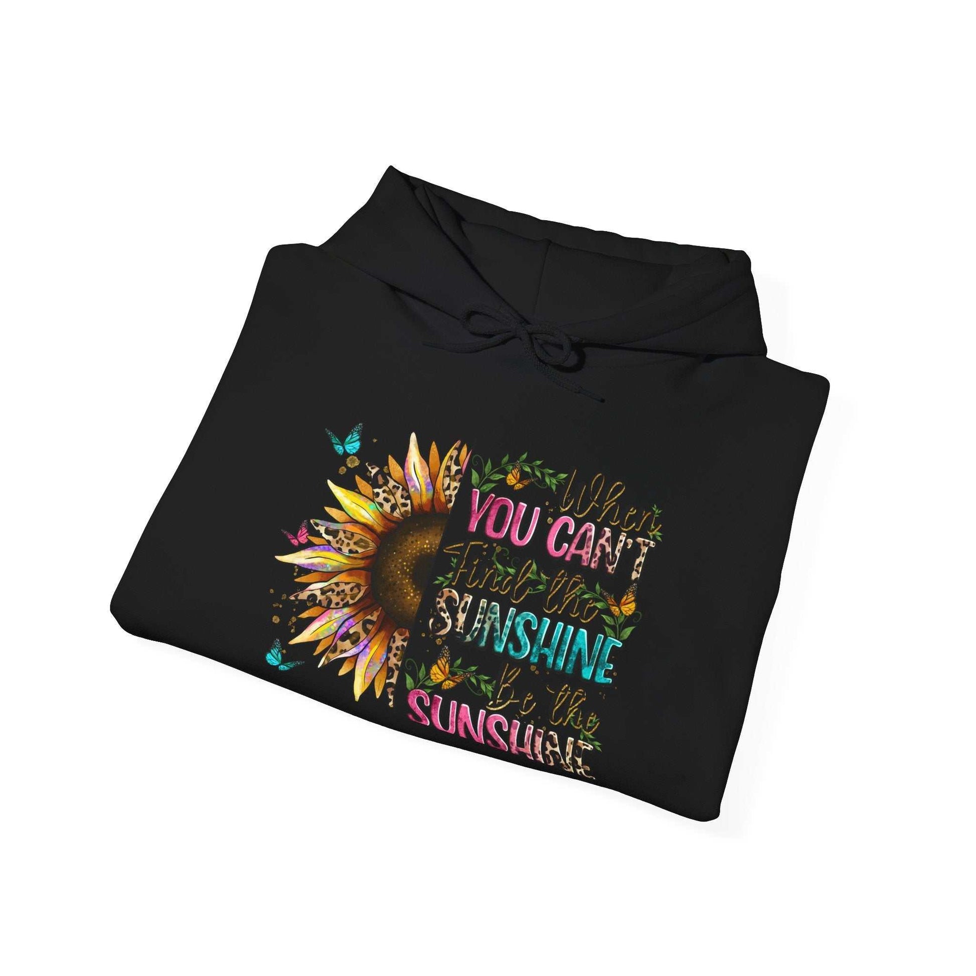 Black hoodie with colorful sunflower and inspirational quote design saying "When you can't find the sunshine, be the sunshine"