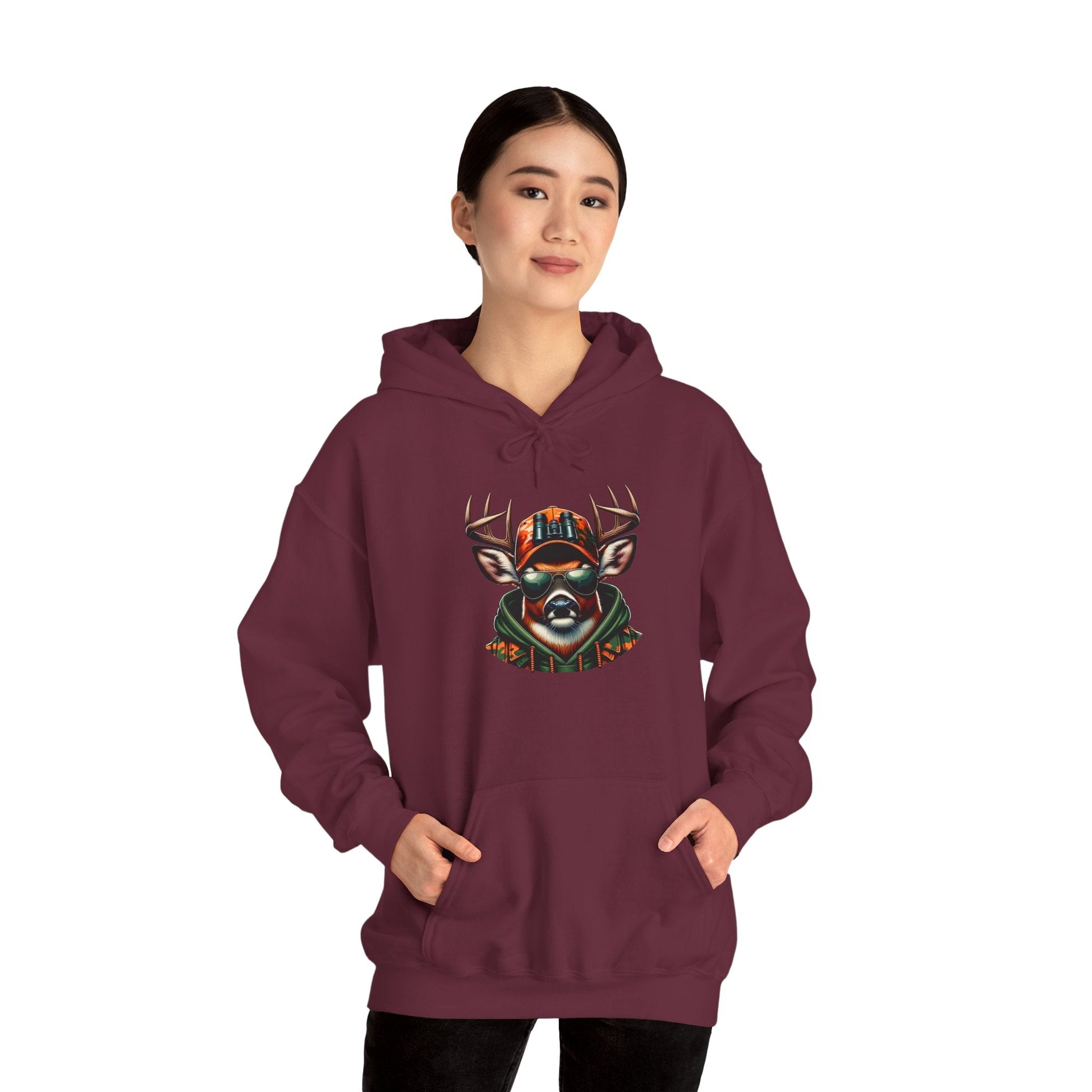 Woman wearing maroon hooded sweatshirt with bold deer face design and kangaroo pocket