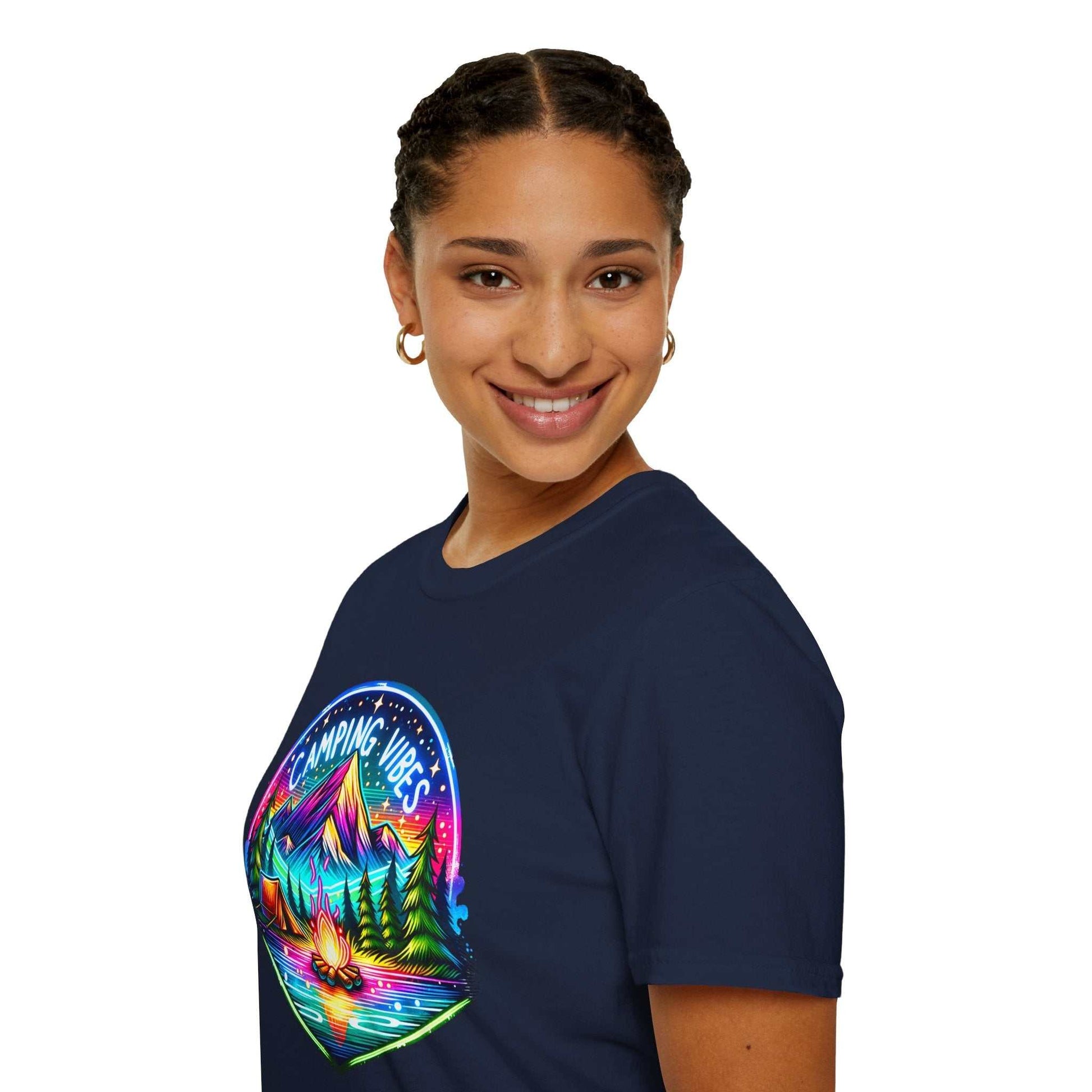 Woman wearing navy blue Camping Vibes Unisex Softstyle T-Shirt with colorful mountain and campfire graphic design