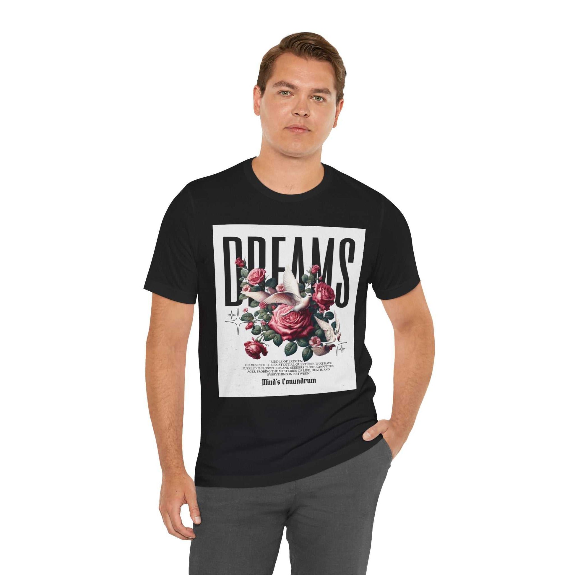 Man wearing black Dreams Floral Tee with floral graphic and bold typography on front