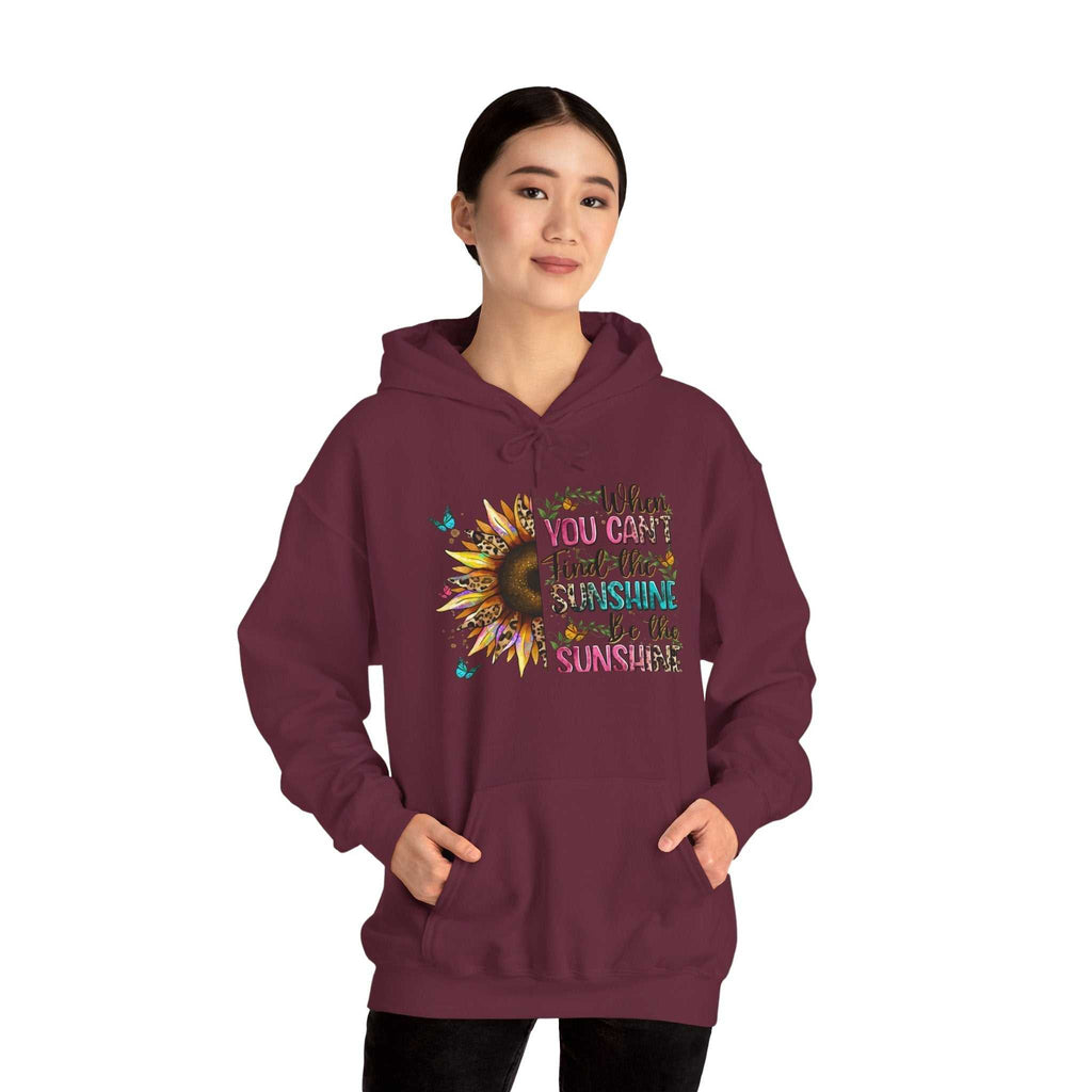 Woman wearing maroon Sunflower Quote Hoodie with inspirational sunflower design and uplifting text on front