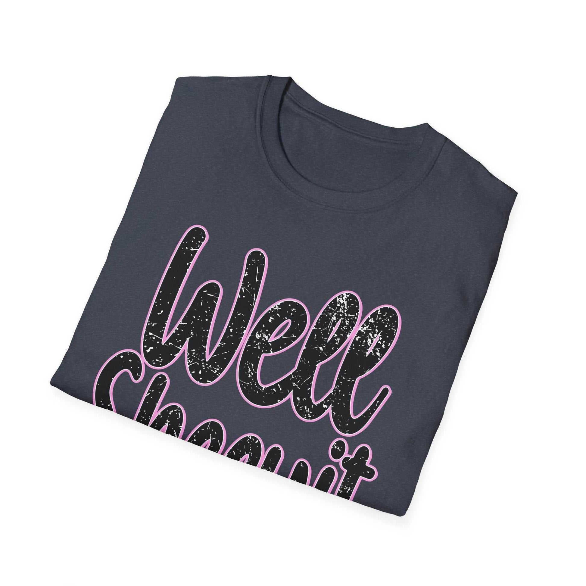 Folded casual statement tee in dark color with "Well Sheeyit" humorous text design in distressed style