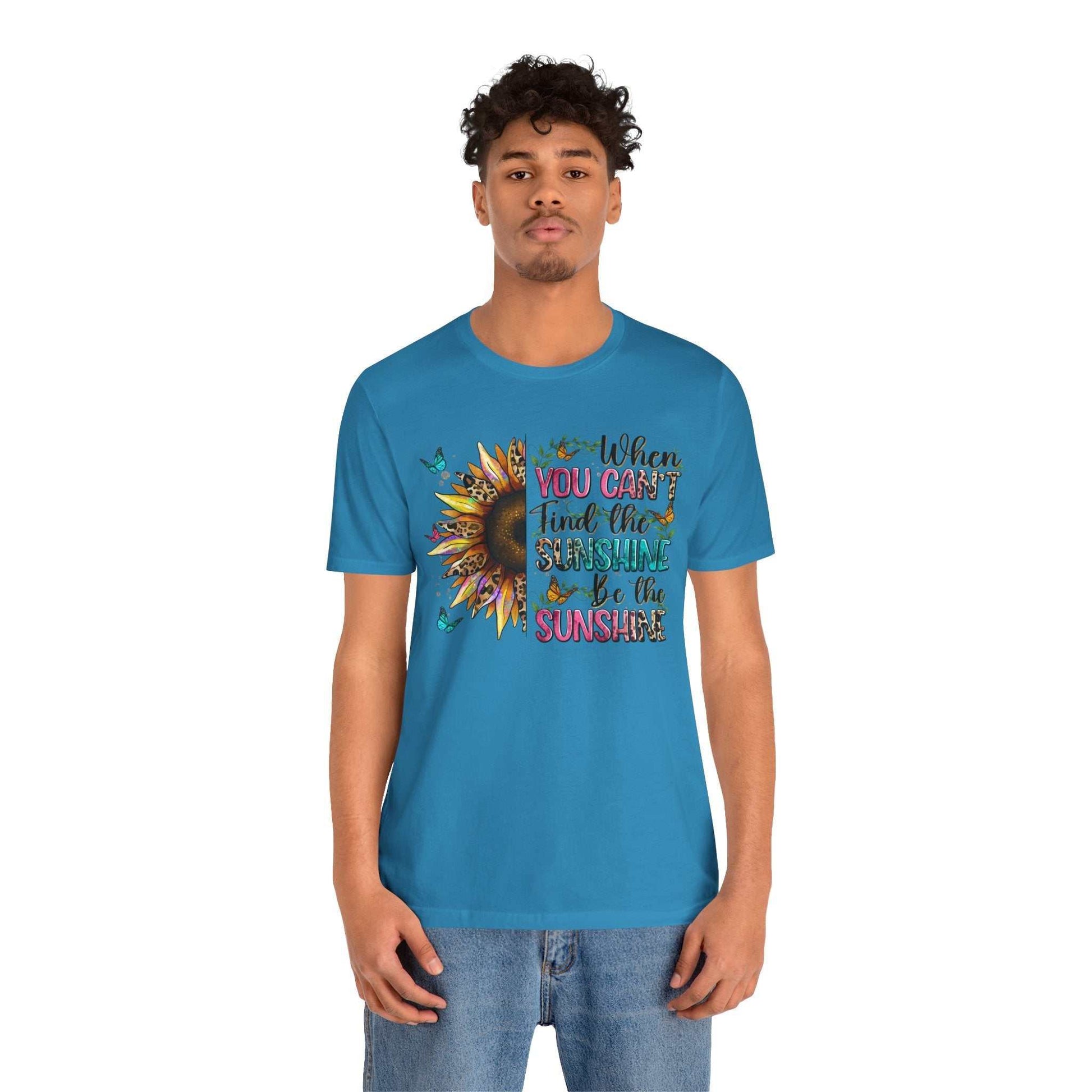 Blue Sunshine Quote Tee with sunflower and positive message printed, worn by male model