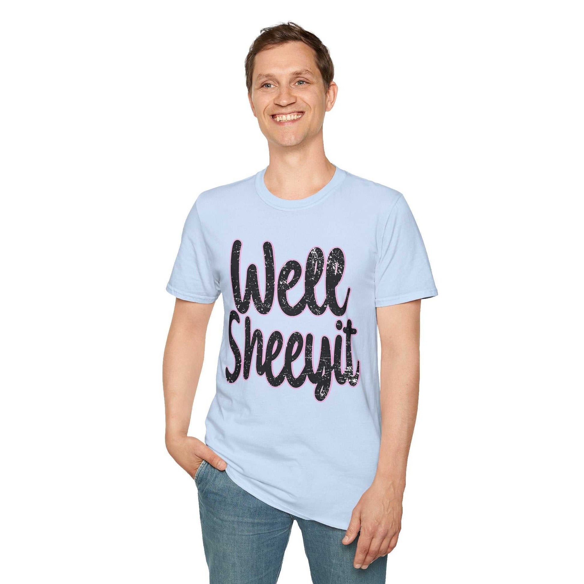 Man wearing light blue casual statement tee with "Well Sheeyit" funny quote in black text, styled for everyday wear.
