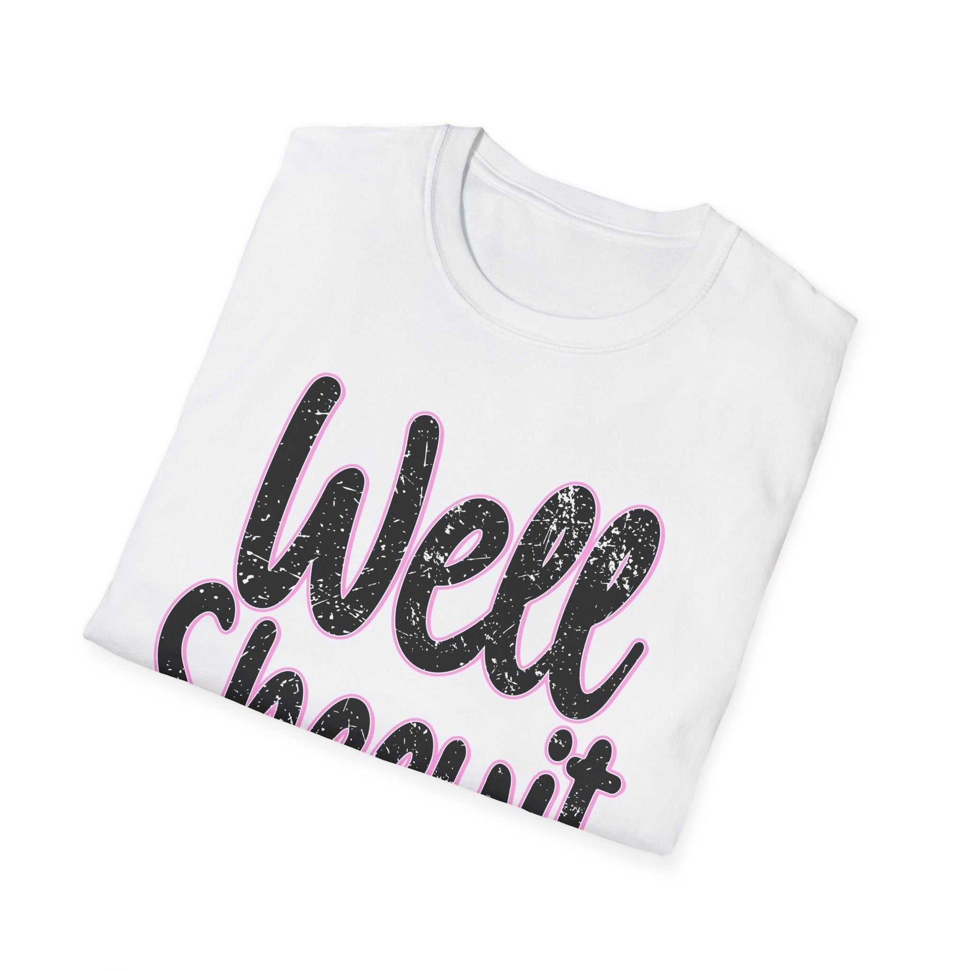 White casual statement tee with "Well Sheeyit" funny quote design, folded for display