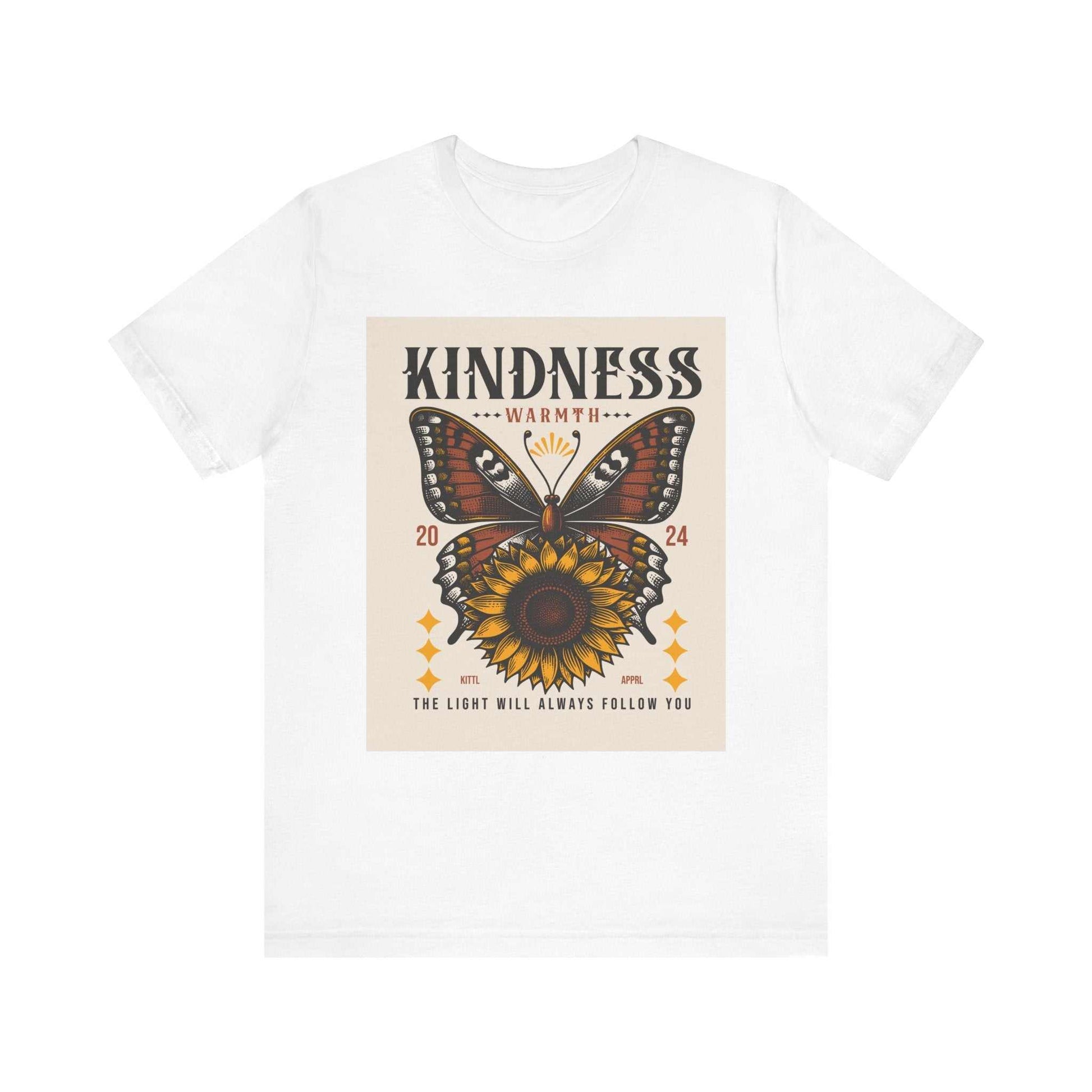 White unisex t-shirt featuring a butterfly and sunflower design with the words "Kindness Warmth" and "The light will always follow you" printed on the front