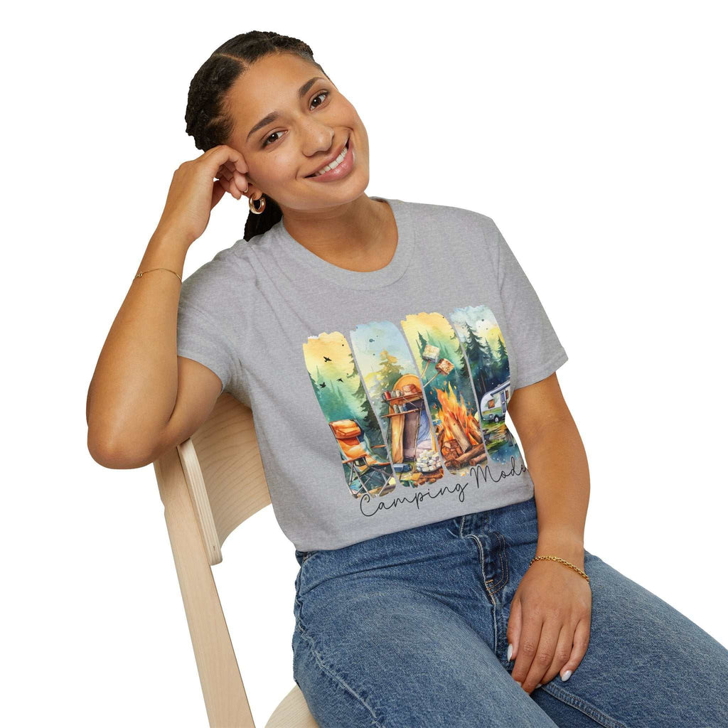 woman wearing gray Camping Adventure Unisex T-Shirt with colorful camping-themed graphic sitting on chair smiling
