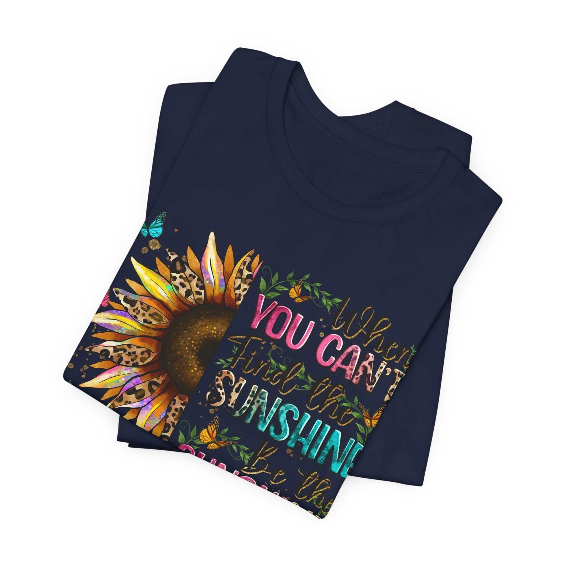 Navy Sunshine Quote Tee with colorful sunflower and motivational text design, made from soft breathable cotton.