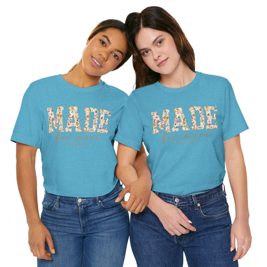Two women wearing blue Made for More Tee shirts with floral print lettering and casual jeans