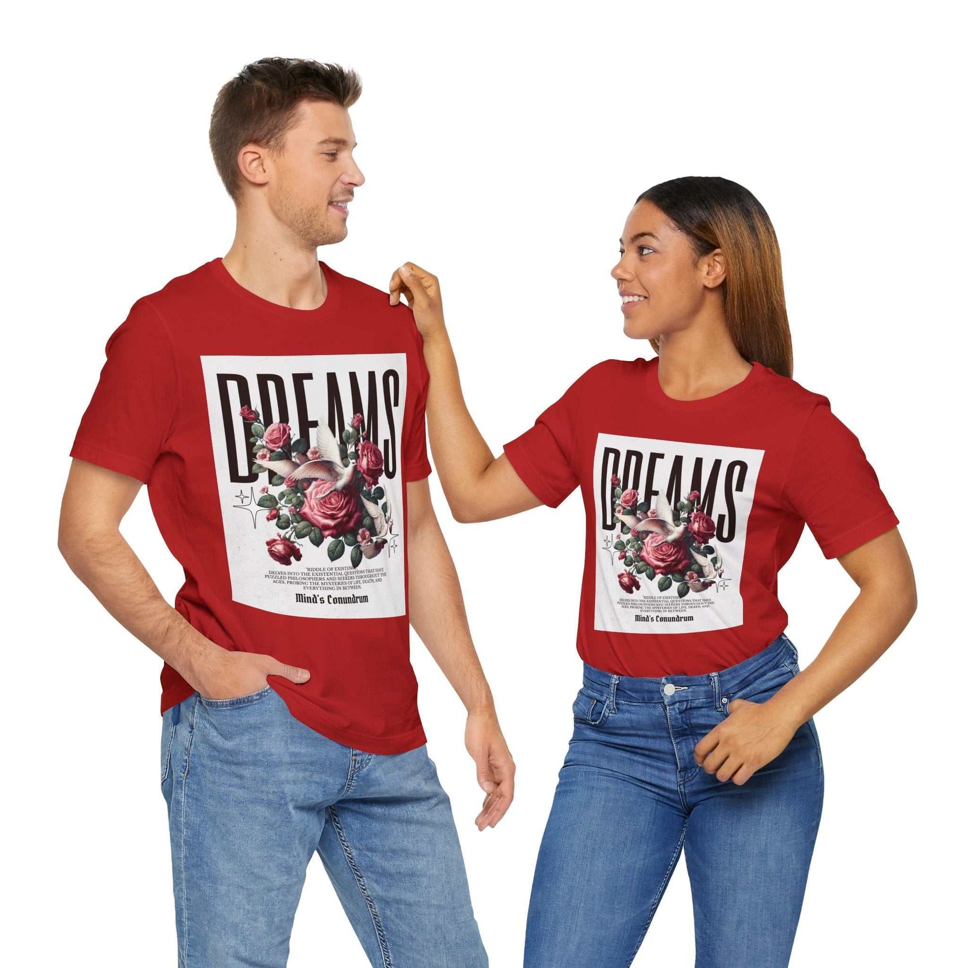 Couple wearing red Dreams Floral Tee with bold typography and floral design, styled casually with jeans.