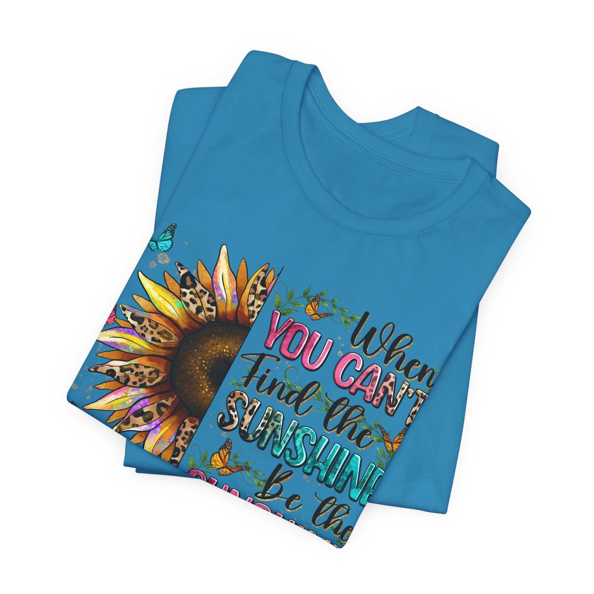 Blue Sunshine Quote Tee with vibrant sunflower and motivational text design, made from 100% soft cotton.