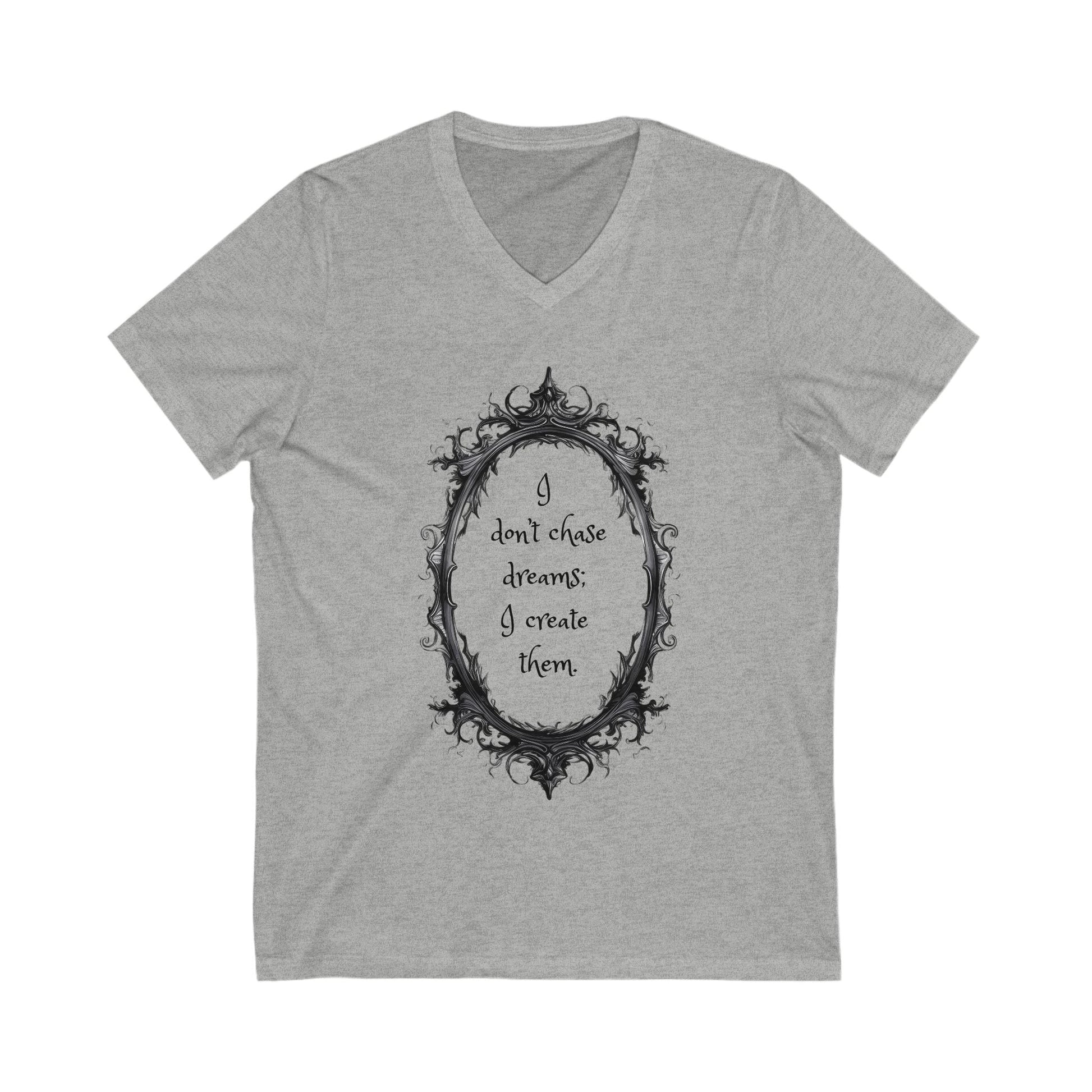 Gray unisex V-neck tee with motivational quote "I don't chase dreams; I create them" inside ornate oval frame