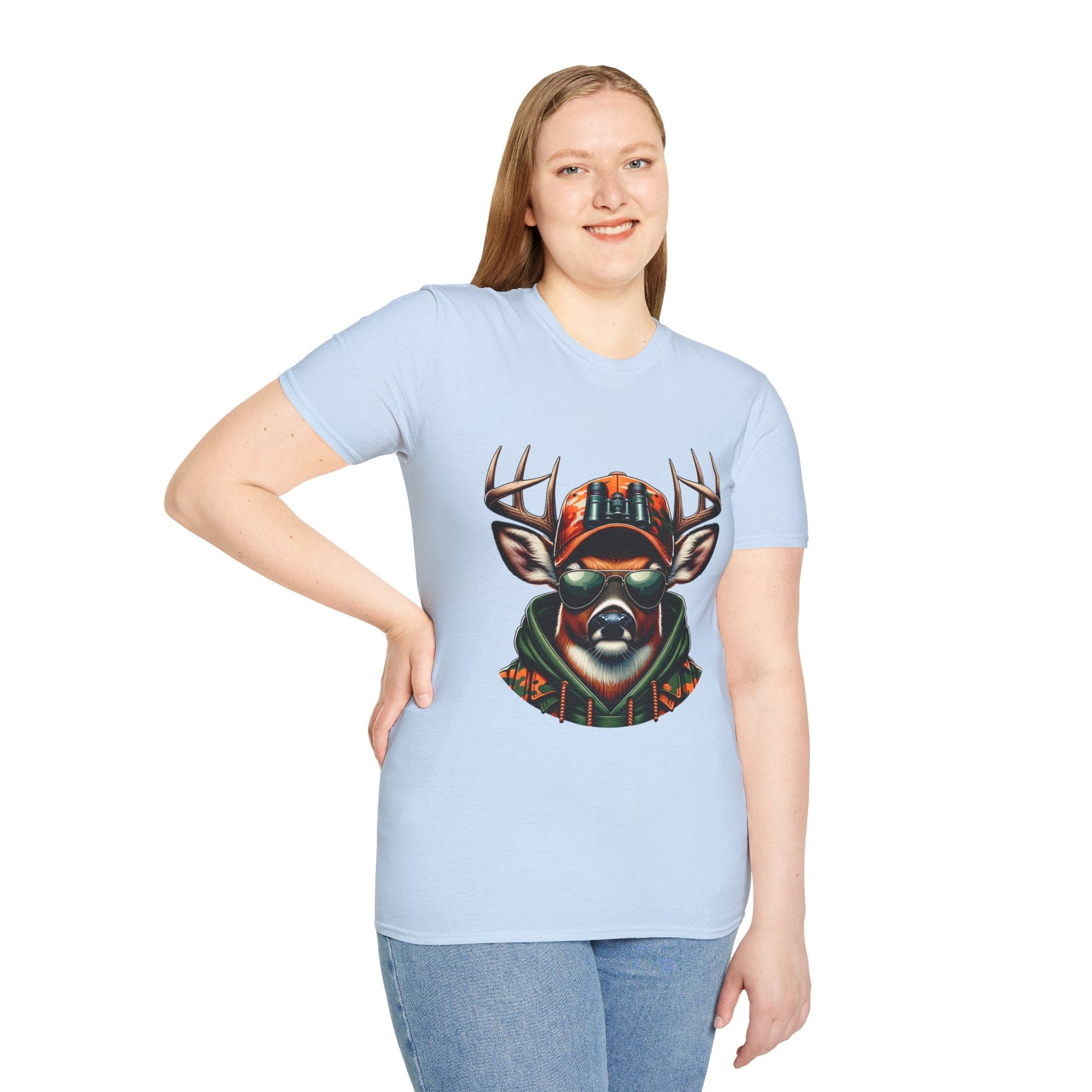 Woman wearing light blue Hunting Enthusiast T-Shirt with graphic of deer in sunglasses and hunting gear, paired with jeans.
