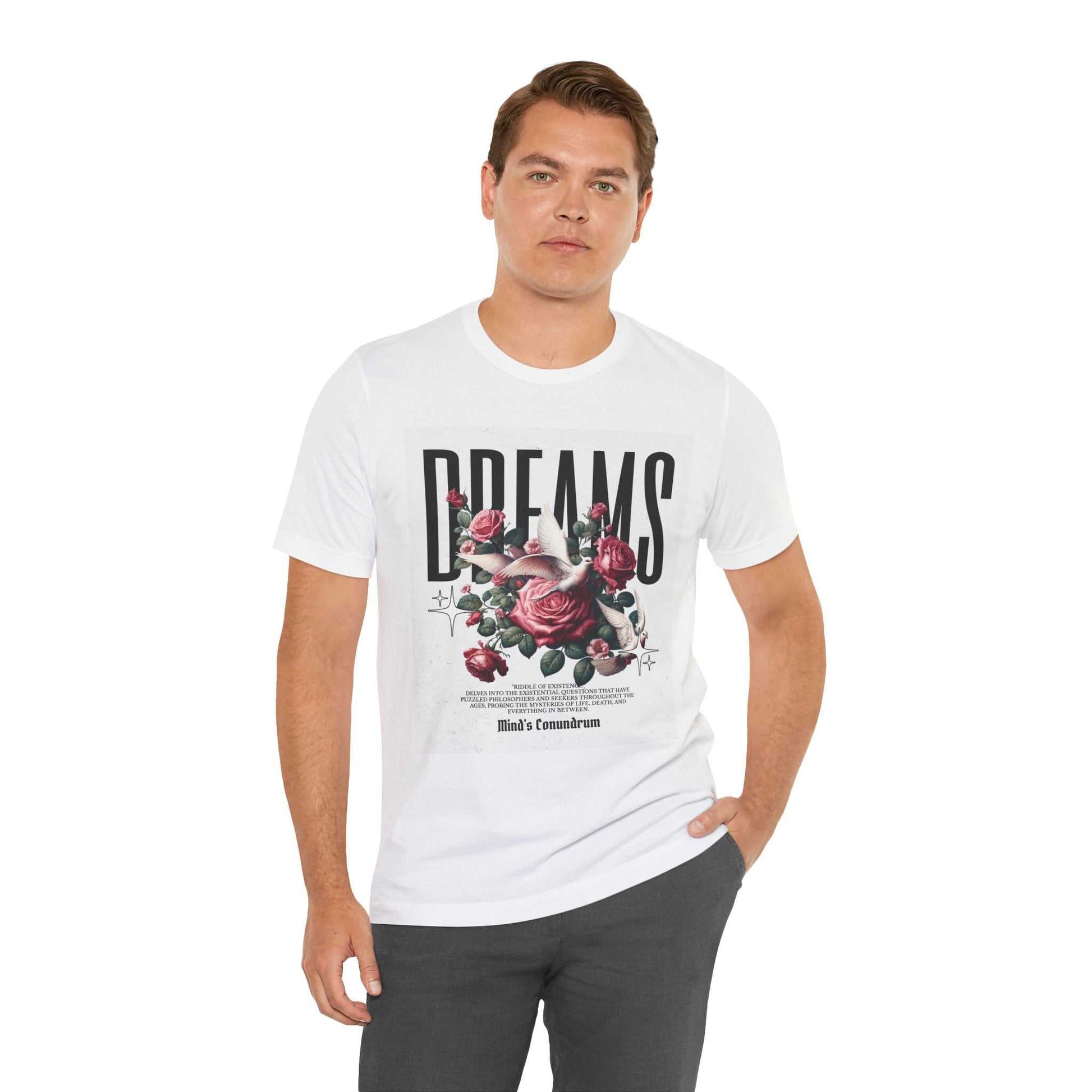 Man wearing white Dreams Floral Tee with bold typography and pink rose graphic design