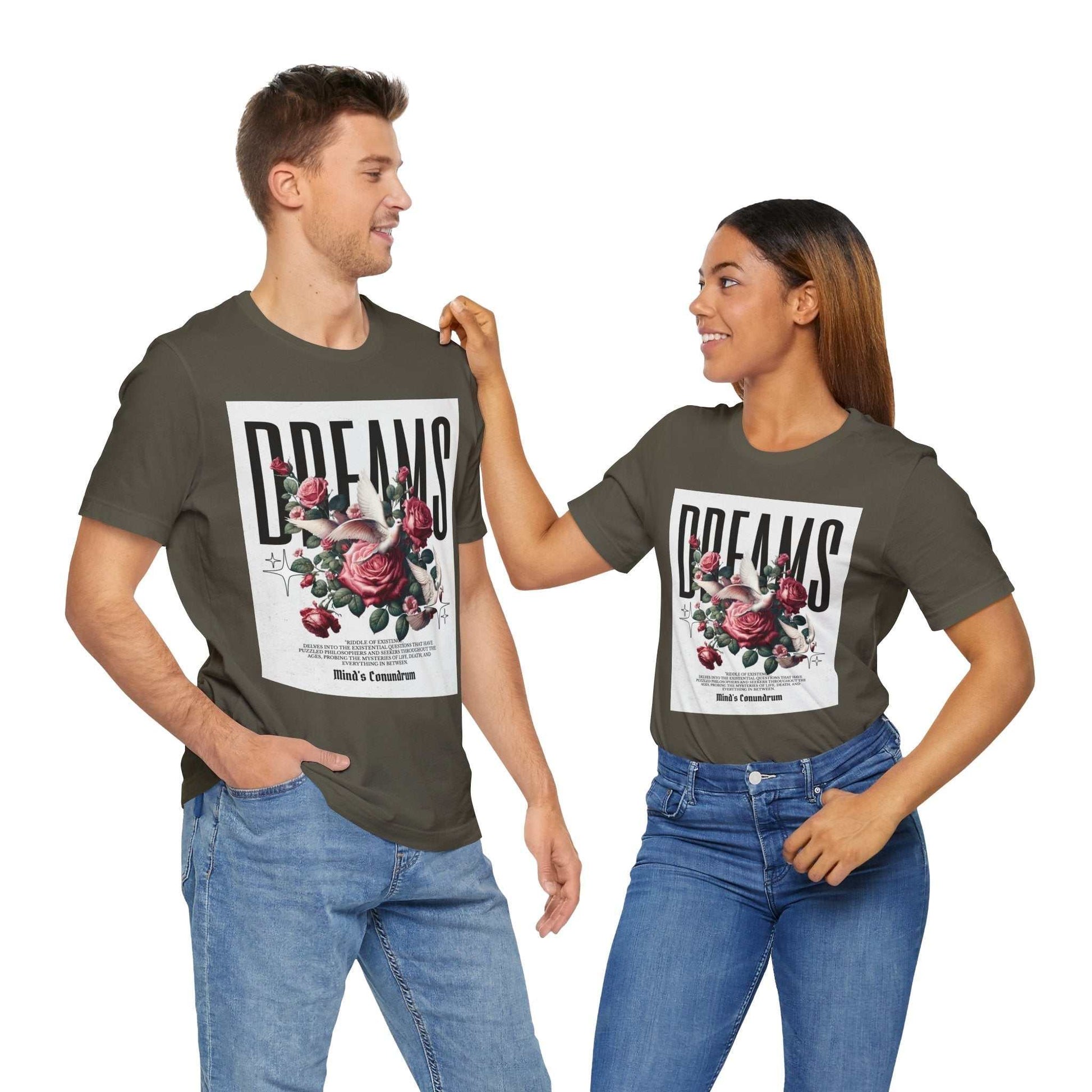 Two models wearing olive green Dreams Floral Tee with large floral graphic and typography on front, casual fit, paired with blue jeans